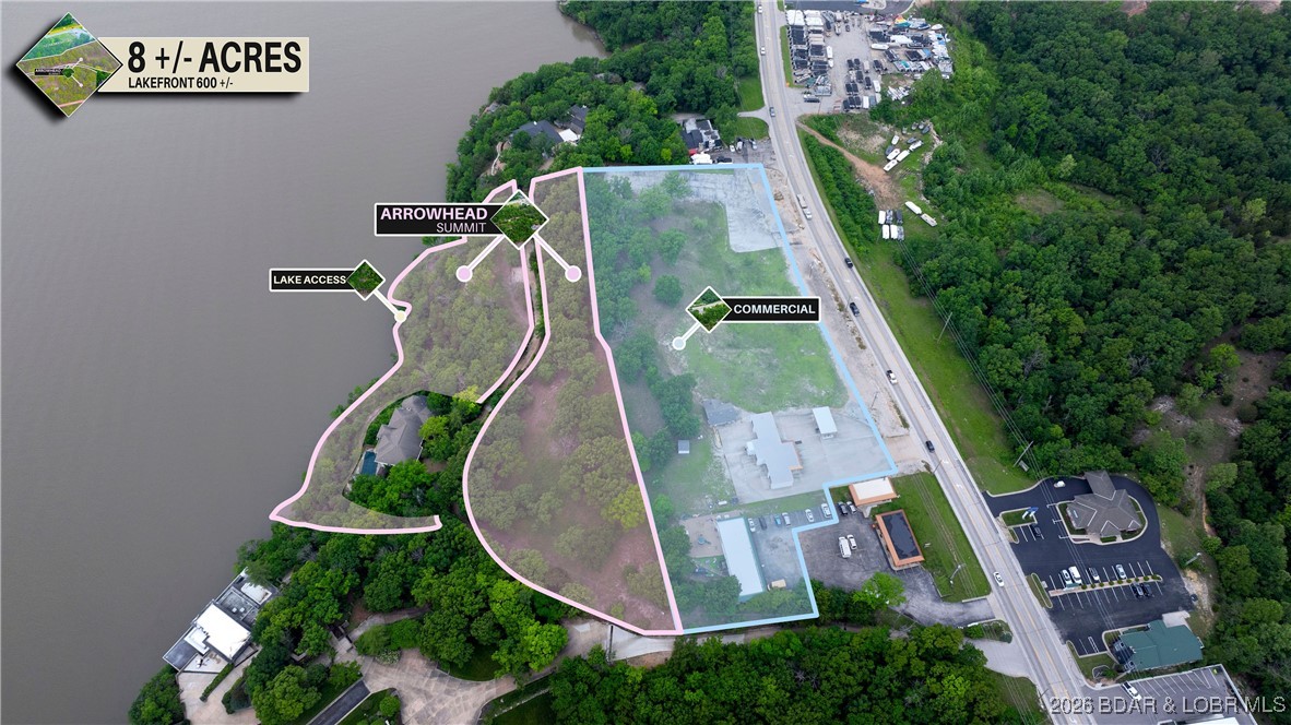 Discover an extraordinary opportunity with this expansive 8+/- acre property that caters to both commercial and residential aspirations. Boasting approximately 596+/- feet of pristine lake frontage, complete with a concrete golf cart path/boardwalk to access the waterfront, and 550+/- feet along Bagnell Dam Blvd, this property offers both high visibility and secluded waterfront privacy. The topography features stunning bluffs and mature trees, creating a backdrop that is as functional as it is breathtaking. Positioned to maximize the spectacular lake views with its unique and unconventional characteristics, it stands ready for the visionary to develop it into a residential paradise and/or a thriving business hub. This is the final prime lakefront mixed-use property available in Lake Ozark. Whether your aspirations involve the development of luxury villas, condominiums, or a boutique hotel, this property's distinctive mixed-use zoning impeccably accommodates such endeavors. Experience the perfect blend of accessibility and solitude in one of the most coveted locations at the Lake of the Ozarks.