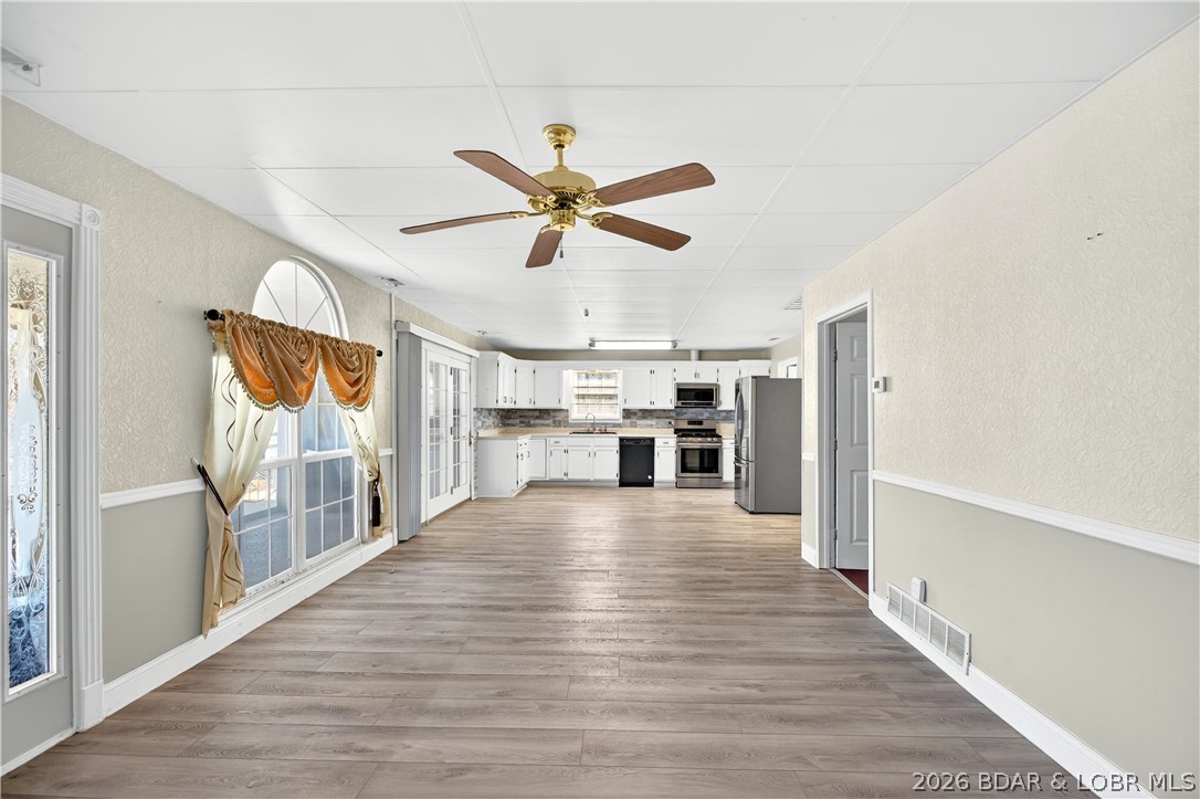 Welcome to your private lake-view retreat at 33268 Greenwood Rd! The seller plans to include a one-year rental of a 10' x 34' boat slip at a nearby marina, located just four minutes away. Hop on your ATV or golf cart and be on the lake in minutes, making it easy to enjoy everything Lake of the Ozarks has to offer.
This one-of-a-kind 3-bedroom, 1-bath earth home blends comfort, privacy, and the natural beauty of the Ozarks. Built into the landscape for energy efficiency, it offers a cozy atmosphere that's as practical as it is inviting.
Take in beautiful lake views from the spacious screened-in porch, the perfect place to enjoy your morning coffee or unwind after a day on the water. Relax year-round in your private hot tub while soaking in the peaceful surroundings. The fenced front yard provides plenty of space for pets, gardening, or outdoor gatherings.
Whether you're looking for a full-time home, a weekend escape, or a fantastic investment opportunity, this exceptional property offers the ideal combination of tranquility, recreation, and lake living. Don't miss your chance to own this truly unique retreat in Gravois Mills!