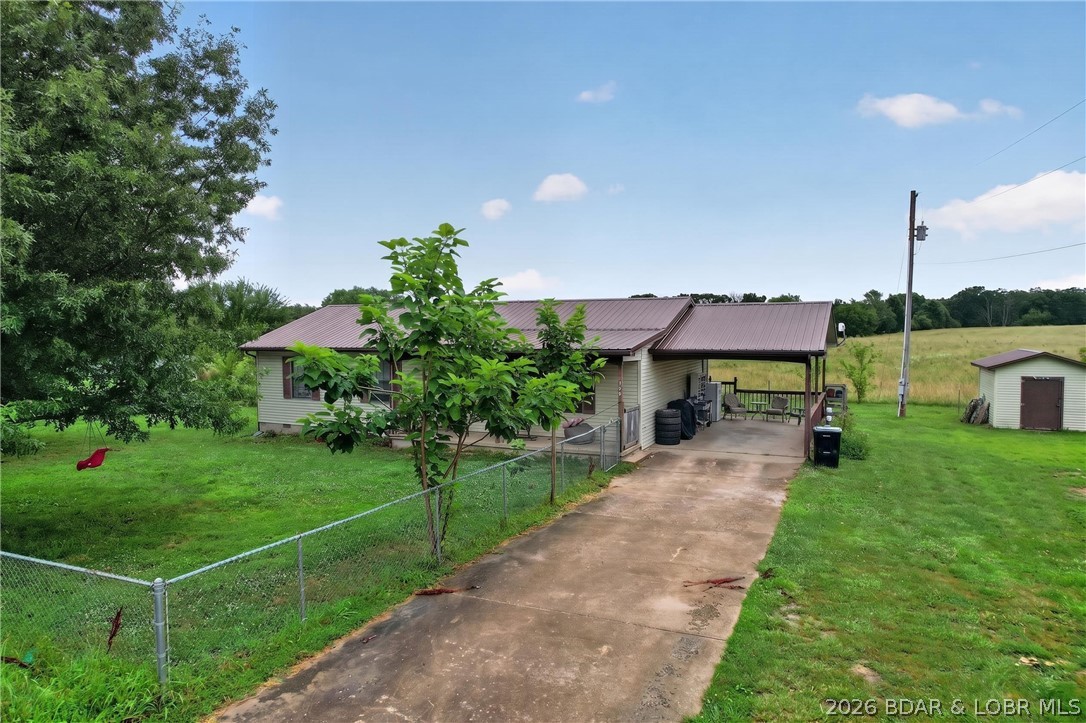 Stop renting and start owning!! Come see this 3BR/1.5BA ranch-style home in a serene country setting, but still not far from town. Functional main-level living featuring a primary bedroom with a half bath, dining area, living-room, hall bath, 2 more bedrooms and a generous laundry room. New luxury vinyl flooring has been installed throughout the home & no worries a new septic has also been installed.  Enjoy the massive, level lot with a fenced in front & back yard perfect for your pets or small children. Carport that could easily be converted into a garage & great parking. The existing carport offers a fantastic opportunity for a garage conversion to add instant equity. Plenty of room for your own garden & storage shed in the back for all your gardening tools. Perfect for first-time buyers, retirement, or investors. This affordable home won't last long—book your showing today!