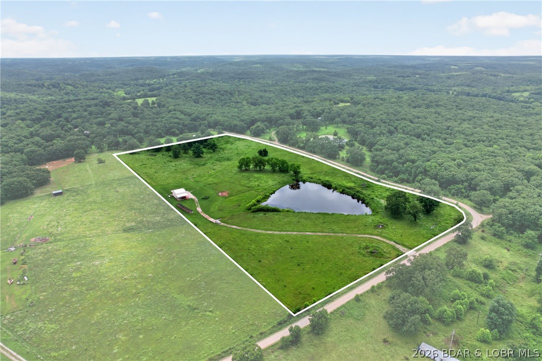You have been looking for a truly OFF GRID property.  This is 20 acres more or less with a brand new 30x30 shed with 17 foot overhang on 2 sides.  Solar powered, new well, new septic, fenced all around with gates, a beautiful pond, AND..... 2100 short leaf pine trees planted a little over a year ago.  Have your own pine forest paradise.  Not far from Climax Springs.  Some equipment is available.  Call and make plans to preview this property now!