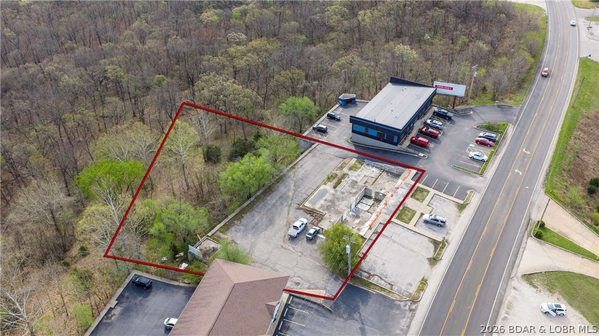 Prime Commercial Opportunity! This exceptional commercial lot is ideally situated in a well established section of Lake Ozark. It offers excellent highway frontage and outstanding exposure for your business. With a strong daily traffic count, this location provides maximum visibility and easy accessibility - perfect for a wide range of commercial uses. This property presents a valuable opportunity for investors, developers, and business owners looking to capitalize on a high demand corridor - close to the historic Bagnell Dam strip AND the planned casino. Don't miss out on this opportunity to secure a premium location with so much potential.