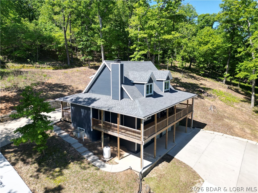 MOTIVATED SELLER!! This brand-new custom home sits on 17.35 wooded acres(includes 3 more buildable lots-see map) with stunning 55MM views and abundant wildlife, plus COMO Fiber Internet and a 12x32 covered boat slip in the community dock. In the upstairs of this spacious home you'll find a multi-use loft/bedroom area, a bathroom with tiled walk in shower, another bedroom, and 2 large walk-in closets. The main level's open-concept design is highlighted by a chef's kitchen with custom cabinetry, quartz countertops, and stainless appliances which opens to the inviting vaulted living room featuring a high-end propane fireplace. The primary ensuite includes a double bowl vanity, beautiful tiled shower, access to the walk-in closet, plus the laundry room/half bath is just steps away! All 3 open to the nearly 360 degrees covered wrap-around deck--perfect for seasonal lake views including an active eagle's nest. The walk-out lower level includes a family room with electric fireplace, a wheelchair-accessible bedroom and bath, and access to the extra-deep 27x12 garage. Buyer may opt for the home on a 3.05 acre lot for $699,900 as shown in listing MLS#3587141. See survey map showing all lots.