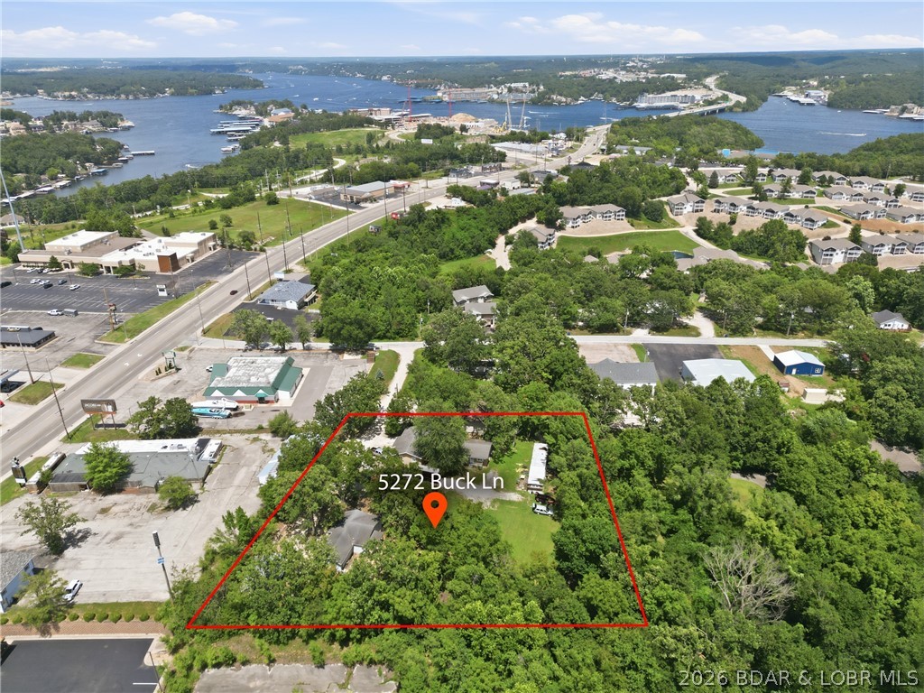 Prime investment opportunity in the heart of Osage Beach! This income-producing package features 6 occupied, income-generating units on 1.1 acres & parking for 2+ cars per unit. Sold as-is to maintain current tenant cash flow, this unique property includes: 2-unit duplex (each unit is a 1-bed/1-bath, 480 sq ft); 2 stand-alone cottages (each is a 1-bed/1-bath, 528 sf with knotty pine interiors); 2-bed/1-bath mobile home (672 sf, featuring central heat/air, wood laminate & vinyl throughout), yard, and 2 private decks); and Single-family home (3-bed/1-bath, 1100+ sf, with hardwood and ceramic tile throughout-no carpet, a 2-car carport and dedicated storage room). All units are occupied with active rentals in place—start collecting rent on day one! Beyond immediate cash flow, the property boasts incredible future development potential. Zoned R-2 in a highly desirable, central location, the site is perfectly positioned for future redevelopment. Build a brand-new, modern single-family home or a duplex to maximize the property’s long-term utility and value. Do not disturb tenants. Schedule your private showing today! The parcel next door, with 2 more homes, is available for additional $$.