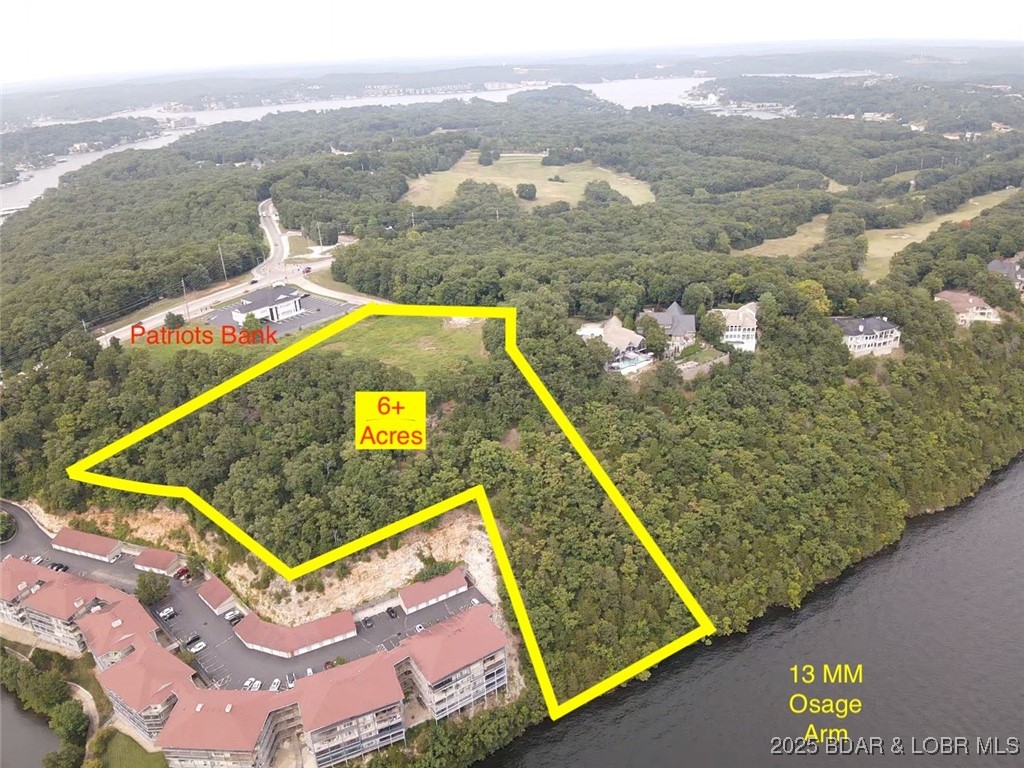 Exceptional Waterfront Development Opportunity – Lake of the Ozarks!

Discover a truly unique development opportunity in one of Lake of the Ozarks’ most prestigious locations. Situated on a panoramic blufftop with sweeping lake views, this one-of-a-kind property on Horseshoe Bend Parkway offers unmatched potential.

Perfectly suited for a luxury condo project, upscale adult living community, executive office complex, fine dining establishment, or an exclusive private estate, this site combines location, scale, and vision.

Neighboring the renowned Cedar Crest Residential subdivision, the property offers both prestige and convenience. Development plans allow for the potential construction of a 40-slip marina with tram access, as well as 245 parking spaces, making it ideal for high-end residential or commercial use.

Don't miss this rare chance to develop on one of the most desirable waterfront parcels in the region.