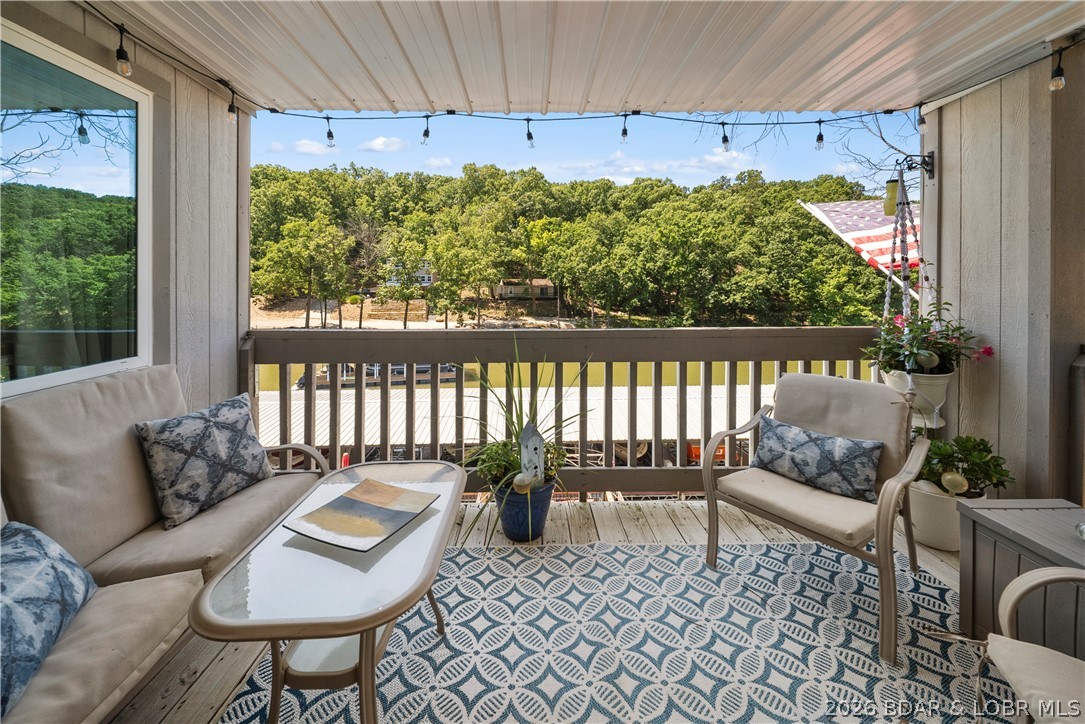 Incredible location. Incredible views. Incredible price. If you've been searching for the perfect lake getaway that combines convenience, affordability, and effortless lake living, your search ends here. This beautifully remodeled 2-bedroom, 2-bath condo is offered completely turnkey, allowing you to start enjoying the Lake of the Ozarks lifestyle from day one. The bright, open-concept floor plan is filled with natural light and flows seamlessly to a cozy covered deck where you can relax and take in the lake views. The spacious primary suite features a beautifully updated walk-in shower, while the included 10x24 boat slip puts endless days on the water just steps away. Spend your summers lounging by the lakeside community pool, cruising the lake, or exploring nearby waterfront restaurants, shopping, and entertainment. Annual rentals are permitted, making this an excellent opportunity for a full-time residence, weekend retreat, or income-producing investment. Opportunities like this at this price don't come along often!