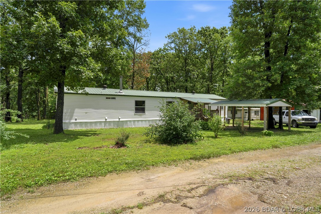EscaEscape to the peace and serenity of the countryside with this beautifully remodeled property situated on +/- 3.5 unrestricted acres. This 2BR 2BA manufactured home, remodeled in 2025-2026, offering updated finishes, all new Kinro vinyl windows, all new fixtures (you'll love the luxurious 6' tub in primary bath), new wood stove (2025), NEW appliances (2025-2026) and comfortable one-level living in a serene rural setting. In addition to the main residence, the property features a large 3-bay shop with 3 new garage door openers and 3/4 bathroom and loft bedroom, making it ideal for overnight guests.  Extra single-wide trailer with power, water and 1/2 bath, currently used for storage .  Several outbuildings and covered storage areas offer abundant room for tools, vehicles, boats, RVs, farm equipment, etc. Gentle sloped yard includes a shoot house and wet weather creek.  Whether you're looking for a hobby farm, home-based business, investment opportunity, or simply a private country retreat with plenty of room to grow, this property offers the flexibility and space that's becoming increasingly difficult to find. Schedule your showing today before this unique gem slips away!