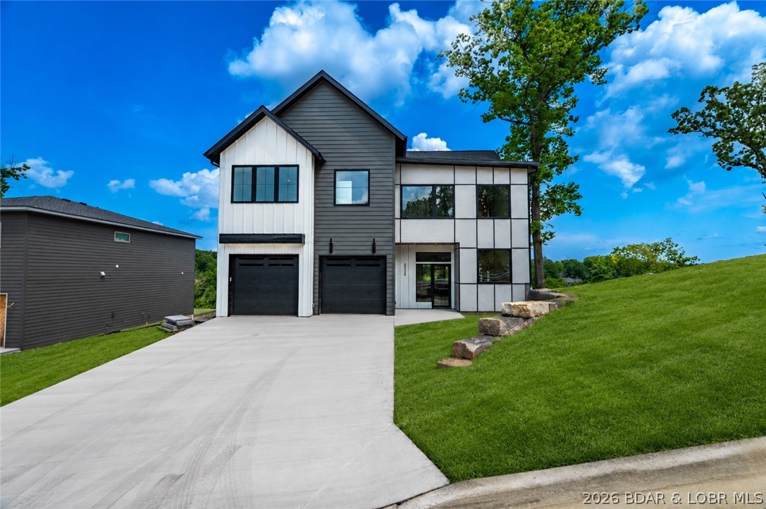 New construction with flat driveway, lake access w/included 12x32 slip & beautiful lake views in the heart of Osage Beach at Harpers Cov! Ideally located by both land & water. Access to a variety of boat slip options w/ convenient golf cart access to the docks. Residents enjoy outstanding community amenities: a lakeside pool,park,streetlights,community trash service, & city water & sewer. Designed for modern living, this 4-bedroom home features two en-suite bedrooms, spacious laundry room, & open-concept layout. Primary suite offers a walk-in closet & a spa-inspired bath w/ a luxurious wet room featuring a soaking tub & tiled walk-in shower. The gourmet kitchen is equipped w/ high-end appliances, ample cabinetry, & walk-in pantry. Expansive great room with fireplace flows seamlessly to the oversized deck & firepit area, creating the perfect setting for entertaining family & friends. Quality craftsmanship, upscale finishes, & thoughtful design are evident throughout. Oversized garage provides storage space. Great for full-time residence, vacation getaway, or investment opportunity, this desirable community delivers the perfect blend of comfort, convenience, & lake living.