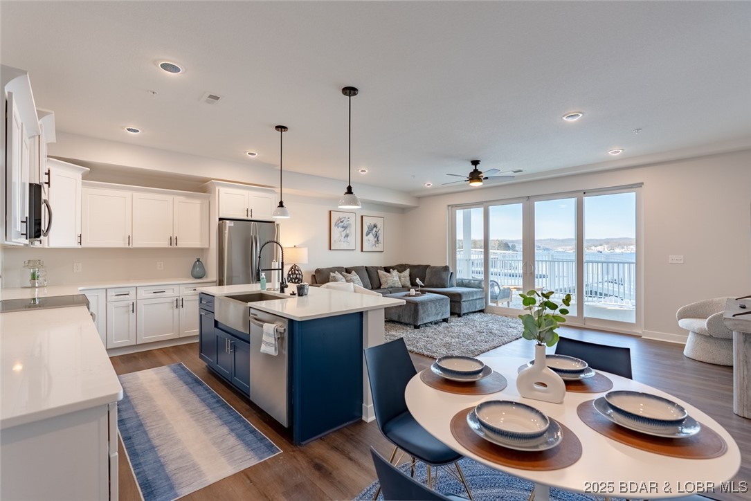 Awesome End Unit-That is staged with beautiful furniutre & accessories that are available w/ possible "turn-key" package, that walks directly out to the two pools & the boat docks.It's a cool set up w/ the large concrete patio that offers a private gate that gives direct accesss to amenties. Unit offers an open floor plan w/ stainless steel appliances & granite in the kitchen, full dining area, pantry, Great room & full laundry rm w/ storage. Master Suite is Lakeside w/ double vanity sink, walk-in tiled shower & walk-in closet. The 2nd bedrm is an En-suite to the full bath. Awesome use of windows & sliders that are 8ft. The setting is ideal as this sits perfectly inside a large cove that offers protection for your dock-yet an unwavering view of the main channel.Elevator access to every floor and the community dock that offers a fish cleaning station. Pet area.  Location is ideal as your are only minutes from all the amenities.  Spacious decks offer views that will take your breath away, along w/ a storage closet & can be screened. Docks & PWC's are available for additional $ and various sizes available.Note: Each buyer to contribute $1500 towards the Reserve Fund at closing.