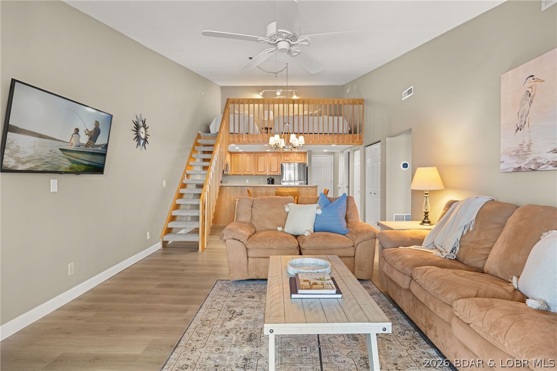 Experience the ultimate Lake of the Ozarks lifestyle in this stunning 3 bedroom and 2 bathroom top floor condo at Bridgepointe in Osage Beach. Boasting a prime location at the intersection of the 19 MM of the Osage and the 1 MM of the Grand Glaize Arm, you will enjoy breathtaking panoramic views and legendary sunsets from your private deck. This turnkey unit comes fully furnished & features extensive updates that provide a fresh and modern feel throughout. The living spaces are enhanced by sleek new luxury vinyl plank flooring and bright LED lighting, while the versatile third bedroom loft features new carpet. The heart of the condo has been elevated with a full suite of new stainless steel kitchen appliances. Both bathrooms have been completely renovated with new flooring, cabinets, light fixtures, & quartz vanity top in the guest bathroom. Included is a 12 x 28 boat slip and PWC slip. The roof was replaced in 2024. Whether you are seeking a full time residence or a vacation retreat, this condo delivers the perfect blend of style and lakefront serenity. Additional amenities include a clubhouse perfectly suited for parties and a large community pool.