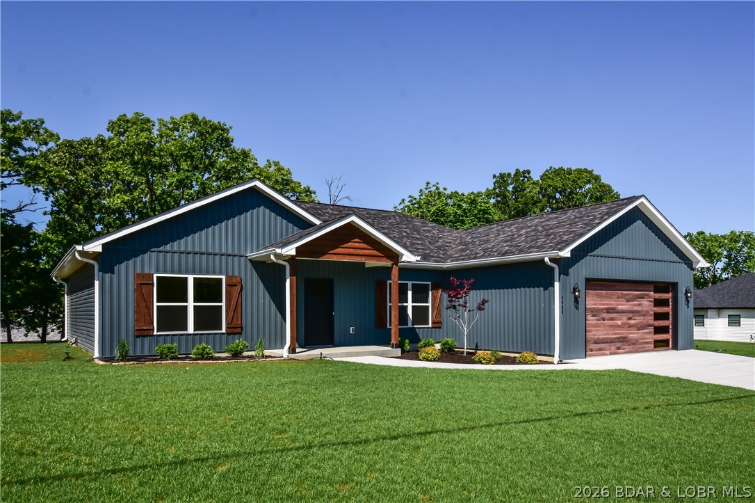 BRAND NEW HOME in the HEART of Osage Beach!! This striking home features an open floor plan, a very inviting kitchen featuring granite countertops, large island for extra seating, custom cabinets, glass tiled backsplash, and upgraded stainless appliances. Plenty of room opposite the kitchen for a large dining table. As you walk through the living room with trey ceilings, you will see a very generous master bedroom with en suite featuring custom cabinets/countertops, a master shower with custom tile work and glass shower enclosure, and a large walk-in closet. The additional two bedrooms are both amply sized and share a guest bathroom with custom cabinet with quartz countertop and features a bathtub with shower. A large laundry room off of the kitchen with plenty of space to add shelves to make a pantry. The builder put a lot of thought into this home. Features include 9' ceilings, blown in cellulose insulation, WIFI thermostat, WIFI garage door opener with camera and quiet choice, 4 ton AC Unit. An oversized garage can hold most any auto. This home is literally two minutes from the grocery store and many restaurants. Put this home on your list to see today!!