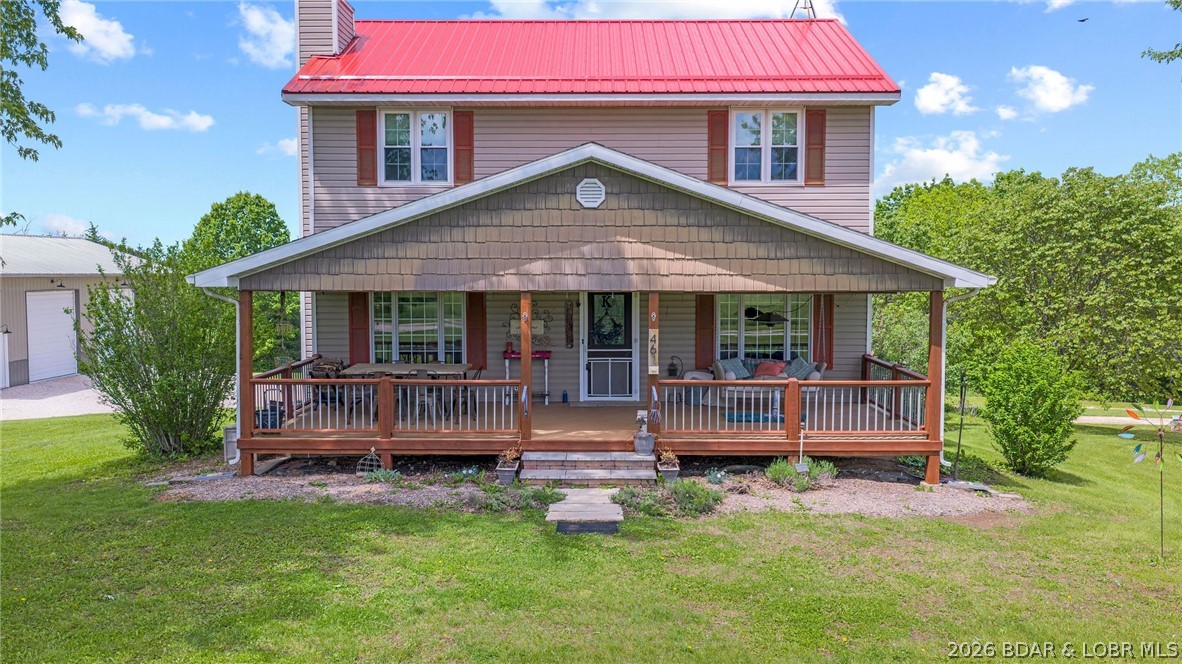 Escape to the quiet beauty of this classic Colonial style farmhouse set on 4 partially wooded acres. Blending timeless architecture with modern comforts, this 3 bedroom, 3 bath home offers spacious living, ample storage space, a full walk-out basement, & beautiful views in every direction. Enjoy relaxed mornings with a book and coffee on the covered front porch swing and peaceful evenings on the covered or open back deck, both perfect for taking in the scenic countryside. The property features an expansive detached 32 x 56 shop with two 12 x 12 garage doors, a large storage loft accessible by lift, 200 amp electric & water built in 2020. Also on the property is an additional 12 x 20 workshop with 100 amp electric, an attached 6 x 12 greenhouse and raised beds for year round gardening. A full RV hook-up with 30/50 amp electric and a dedicated drive grace the property. Conveniently located within easy reach of Jefferson City or the Lake of the Ozarks, this property blends country charm with modern convenience, great for gardening, hobby farming, or simply stretching out and savoring the privacy of the rural life. You have to see this home in person to appreciate its charm & beauty.