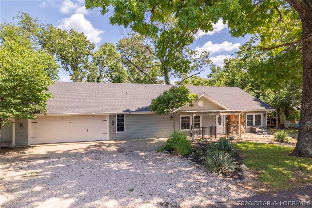 This impressive 6,236 sq ft property has demonstrated strong income potential, generating $132,000 in gross rental income between June 2025 and June 2026. Featuring 7 generously sized bedrooms and 5 full bathrooms, the home offers ample space to comfortably accommodate large groups up to 20 people, making it ideal for continue vacation rental use. The interior has been thoughtfully updated with modern finishes, including stainless steel appliances and high-quality design throughout. Offered fully furnished, this turn-key property allows for a seamless transition to new ownership and immediate rental income. The home has a a new roof, new A/C, new plumbing, and a lot of the electrical improved. The house was also renovated and redecorated this past year. Multiple living areas provide flexibility for guests, while the lower-level entertainment space includes a hot tub, bar, pool table, and mini golf/ putt-putt course, perfect for hosting and recreation. Located just off Bagnell Dam Blvd, the property offers convenient access to restaurants, shops, and local attractions, further enhancing its appeal to renters. The owner is currently leasing a 10x27 boat slip.