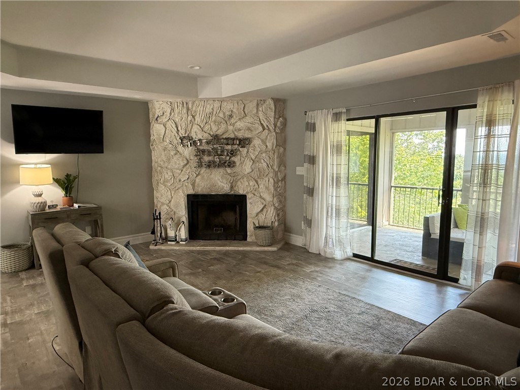 Beautifully remodeled top floor 3 bedroom 2 bathroom move-in ready condo! Offered at a great price! Currently on a successful rental program! Fully furnished, modern fixtures and appliances, and tasteful decor make this condo your perfect lake escape or investment property. Spacious screened in deck with lake view accessible from the living room and 2 bedrooms. Primary bedroom is an en suite and has a full sized bathroom with oversized vanity.  The Osage Vistas condo complex sits on 23 acres of landscaped grounds and offers an abundance of amenities. Osage Vistas resort-like amenities include 6 pools (1 nearby), walking paths, playground, marina with boat ramp and more! Access to Four Seasons amenities are included, too! Four Seasons offers a new indoor pool, multiple outdoor pools, campground, parks, sports courts, and more! Visit https://www.osagevistas.com/home and https://fourseasonspoa.com/amenities/ for more information about the Osage Vistas, Four Seasons, and amenities offered.