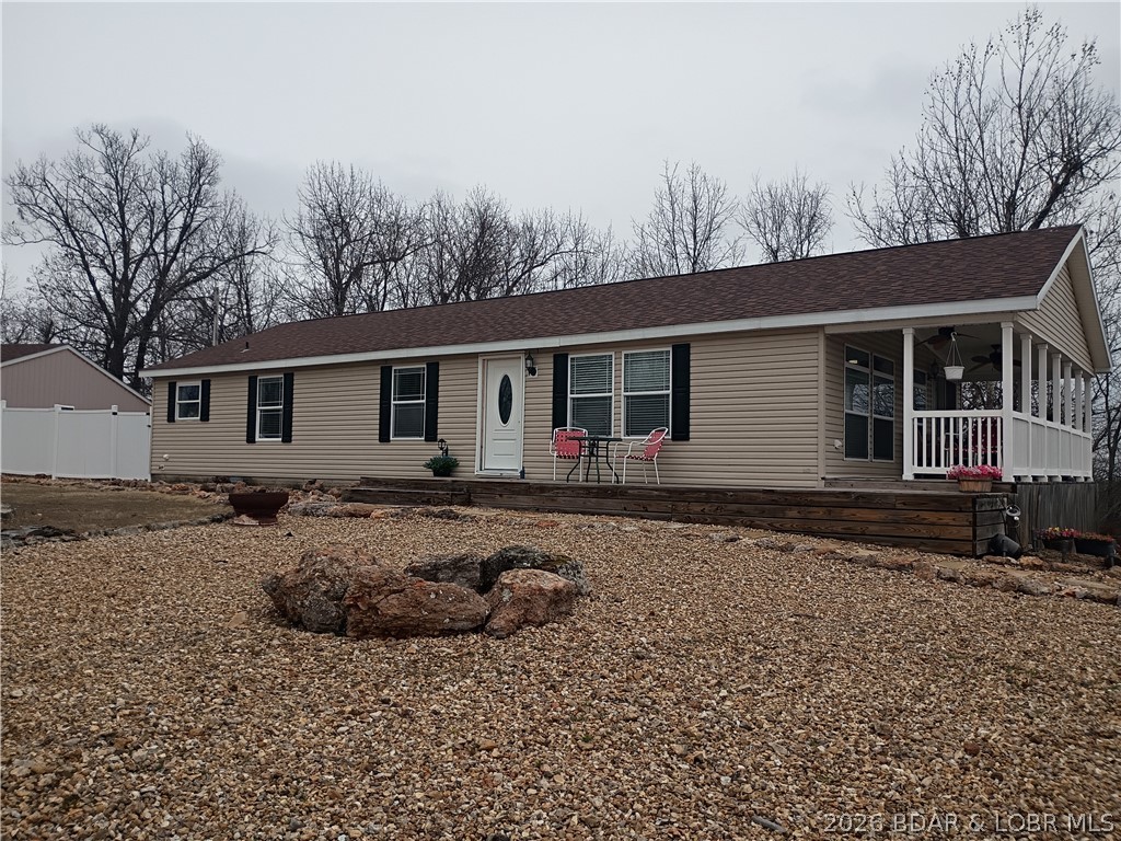 10.1 Acres close to town! Beautiful home for you, 3 car garage for him, plenty of room for workshop, boat and car.  Lake View/Easement! Home, 3 bedroom, 2 luxurious full baths. Located a short distance off of Hwy 5 for easy paved access.  Home had an extensive remodel in 2022.  New wood look floor give you a clean warm feeling as you sit by the cozy fireplace.  Vaulted ceilings and open floor plan, add to the feeling of space.  Primary Bedroom and Bath, has a large soaking tub and walk in shower with rain shower head.  3rd BR is located off of the main living area and has popular barn doors so, it can be used as office or bedroom.  Open Kitchen features, Quartz counters and stainless appliances.  Dining is available at the breakfast bar or dining area off the kitchen.  Bedrooms all have large walk in closets. The outdoor living space can be accessed off the kitchen, large covered porch perfect for morning coffee. Low Maintenance rock landscape is perfect for easy living.  Quality built Home, Hart Housing, Division of Forest River Housing.  TWO HOMES FOR THE PRICE OF ONE! 2 Br guest home offers possible rental income or room for overflow guest.  Second home may be removed or stay.