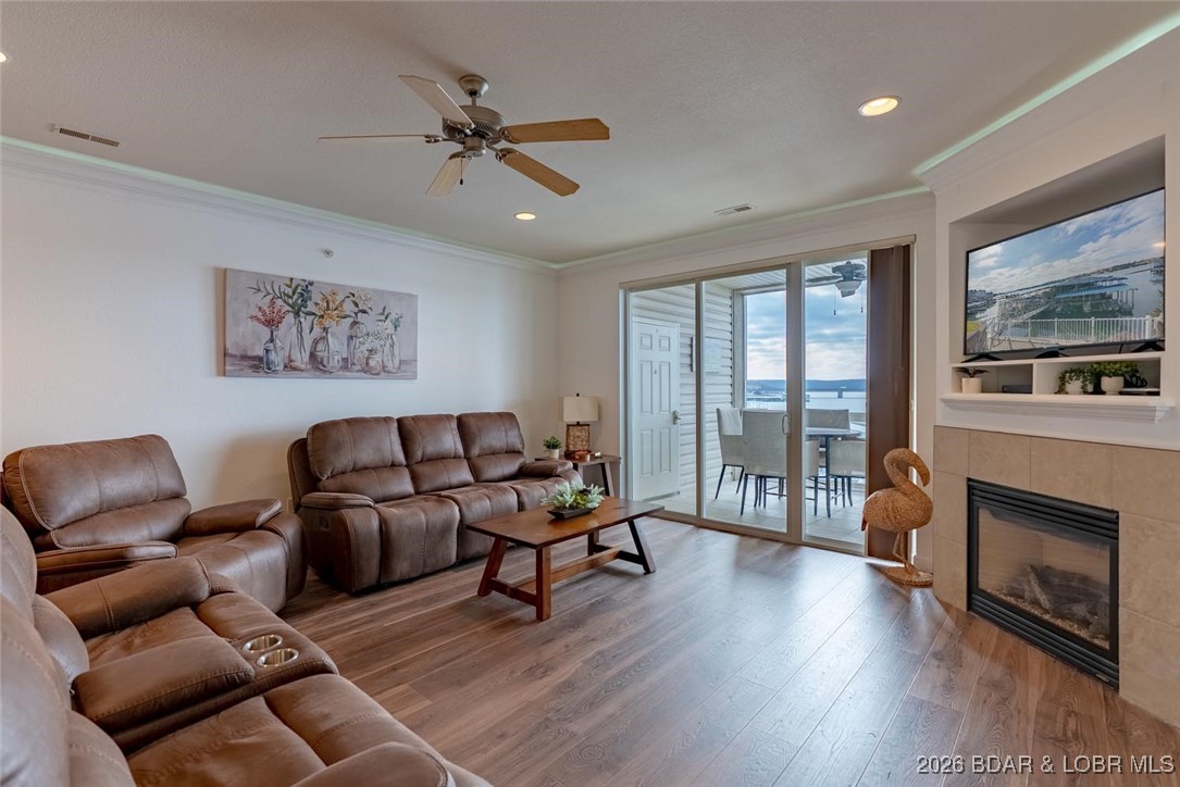 Lakefront Turnkey Investment Opportunity with Nightly Rentals scheduled thru September,2026! This stunning 3-bedroom,2-bath condo offers walk-in access with no steps & breathtaking lake views from every room. Designed for comfort & income potential,featuring a cozy fireplace,ambient lighting,& a luxurious primary bath with jacuzzi tub. The open layout flows easily to a screened deck-perfect for relaxing or entertaining-complete with deck closet. This kitchen,outfitted with brand-new appliances (2025),& a lockable owner/cleaning closet makes this an ideal rental or investment property. Boaters will appreciate the 14x40 boat slip provides prime access to the water. Conveniently located near top restaurants,shopping,trampoline park,& the popular Amusement Oasis,this unit offers easy access by land & water,making it attractive to renters & lake lovers. Located at Lands End,a complex known for its amenities including a cove-side pool,lazy river,clubhouse,playground,fitness room,& protective wave breaks for calmer waters. Whether you’re looking for a personal lake retreat or a high-demand rental,this condo checks every box. Turnkey,income-producing,& ready to enjoy.  MOTIVATED SELLERS