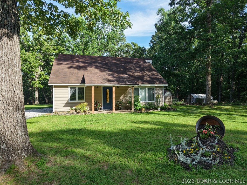 Enjoy peaceful country living on this beautiful 6+ acre property offering plenty of privacy. Step inside the country home featuring a vaulted ceiling with wood beam accents. Large windows create a bright, open area for enjoying family & friends. The home includes a newly updated kitchen with small eat at bar area. All open to dining area that's perfect for family meals and morning coffee. The home offers 3 bedrooms (one currently used as a home office) and 2 bathrooms. One bathroom has a nice corner walk-in shower and one has a full size jetted tub for relaxing & moments of rejuvenation. Walk outside and find a large detached garage/shop complete with a wood stove to keep you warm while working during the colder months. The property is ready for your rural lifestyle with a chicken house, established garden spot already in place and ready for your four legged family members. Expand the entertaining outdoors to the front porch, back covered deck and additional open wood deck. Enjoy the walking path in the wood where you can relax or do some hunting. This is a wonderful opportunity to enjoy space, privacy, and the charm of country living.