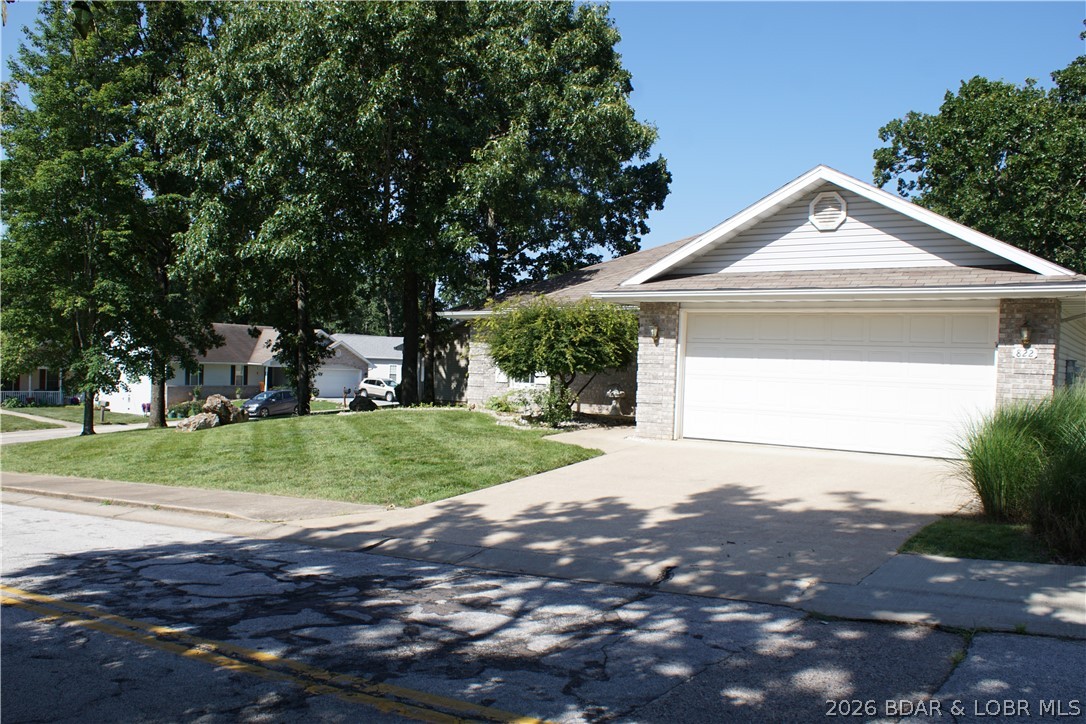 This beautiful 55+ community has a parklike setting and is so well maintained that it sets the stage for the easy living good life that we all work so hard to obtain. This home has beautiful landscaping, mature trees, corner lot, no steps, great Sunroom and a 2 car garage that is insulated and drywalled. Inside has an open floor plan, Master suite, spare bedroom, hall bath, laundry room off kitchen, and living room that shows off that great sunroom. With a little TLC, warm colors and a personal touch, this home will show like a display. Grocery stores and shopping is less then a mile away, as well as great Restaurants, nightlife, entertainment, and major highway. Doctors offices, medical facilities, and hospital are minutes away as well as well known pharmacy. All the convenience of town, but still a beautiful country setting is why this home is a must see.