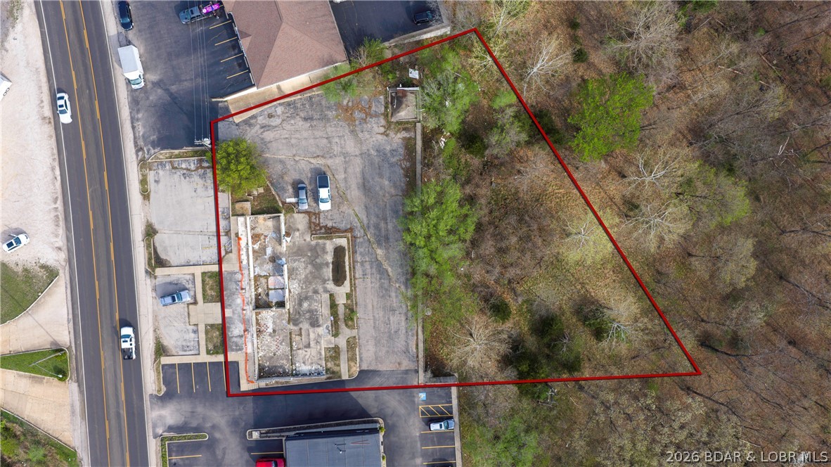 Prime Commercial Opportunity!  This exceptional commercial lot is ideally situated in a well established section of Lake Ozark.  It offers excellent highway frontage and outstanding exposure for your business.  With a strong daily traffic count, this location provides maximum visibility and easy accessibility - perfect for a wide range of commercial uses.  This property presents a valuable opportunity for investors, developers, and business owners looking to capitalize on a high demand corridor - close to the historic Bagnell Dam strip AND the planned casino.  Don't miss out on this opportunity to secure a premium location with so much potential.