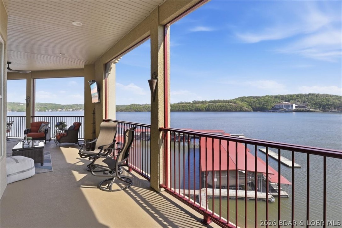 Lakefront Penthouse offers a rare 18 x 48 boat slip, partially set up with patio furniture, wet bar, & mini fridge. Underground garage includes 2 reserved premium parking spots & storage, elevator access to the top-floor WEDGE PENTHOUSE. Spanning 2,000 sq ft, it boasts a massive 37-foot wraparound screened-in outdoor space overlooking the main channel, & soaring 20-foot ceilings for stunning views. The Kitchen features Granite countertops, stylish appliances just 2.5 years old, & plenty of seating at the dining area or center island. The Great room showcases a cozy fireplace, while the Owner’s suite offers main channel views, room darkening shades are installed, a walk-in closet, & a bathroom with a jetted tub & shower. Guest bedroom #1 comes with a private full bathroom & walk-in closet, and Guest bedroom #2 w/ bunk beds has walk-in closet & sits next to the 3rd full bathroom. Extras include a large laundry area, HVAC and water heater just 3.5 years old, newer appliances, Plantation shutters, and fresh paint. Located at the 4 Corners (31mm), the dock features Break Water protection for easy docking, 2 PWC slips, plus a community ice machine. Condo under contract with 48 hr k/o