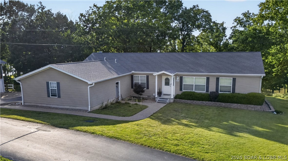 Welcome to one of the most unique properties in Pom-Osa Heights! Bordering Corps ground and offering breathtaking views of Truman Lake, this 3-bedroom, 2-bath home is a rare opportunity to enjoy lake living at its finest. Inside, you'll find plenty of room for family and guests with two spacious living areas, a dedicated dining room, a large primary bedroom, and a generously sized kitchen designed for gathering and entertaining. Whether you're hosting weekend getaways or enjoying full-time lake living, this home offers the space and comfort to do it all. Outside, the property continues to impress with a 2-car attached garage, a detached garage/shop, and an additional bonus recreation room perfect for hobbies, game nights, or extra guest space. Ample parking ensures there's room for everyone. Located in the highly sought-after Pom-Osa Heights subdivision, you'll enjoy paved roads all the way to the property, easy access to a community boat ramp just down the road, and some of the best Truman Lake views you'll find anywhere. Don't miss your chance to own this exceptional lake-area property—call today to schedule your private showing!