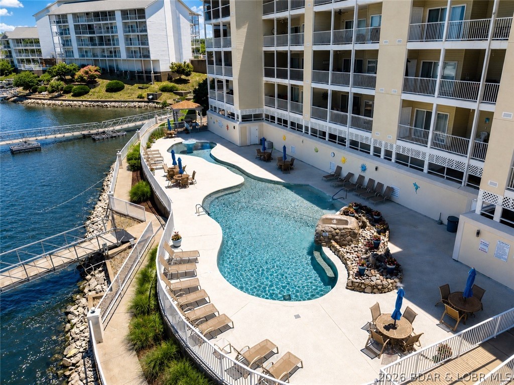 Views like this don't come available often! A TURN-KEY 3 bedroom condo in the highly sought-after Fountainview Landing Complex! Fountainview features one of the largest pools at the lake, perfect for cooling off and gathering with friends and family. This beautifully maintained unit offers a spacious open layout, perfect for relaxing or entertaining. Enjoy stunning lake views from your private deck, ideal for morning coffee or evening sunsets. This unit also includes a 12x32 boat slip and A GARAGE—rare and highly desirable amenities at the Lake of the Ozarks! Located in the heart of Osage Beach, you’re just minutes from top dining, shopping, and attractions by land or water. This complex allows nightly rentals, making it an excellent investment opportunity or vacation getaway. Whether you’re looking for a full-time residence, weekend retreat, or income-producing property, this one checks all the boxes. Don’t miss your chance to own in one of the lake’s most desirable locations! Summer is almost​​‌​​​​‌​‌​​​​‌​​‌​​​​‌‌ here!