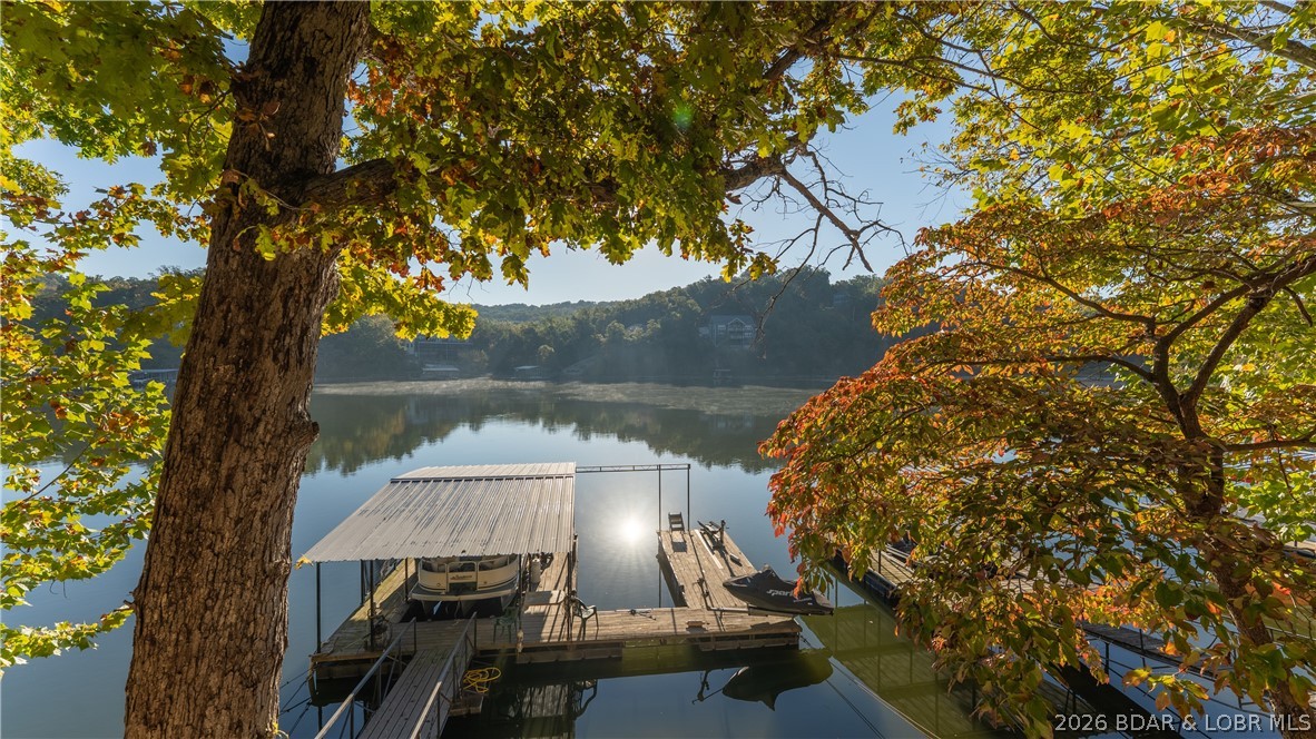 Highly Motivated, Make an Offer. Great Investment opportunity. Nice 2 Bedroom Turn Key Lake front home. In very peaceful and quit possum Hollow Cove off of Lyn Creek Cove. Close to several restaurants, by boat or land. Shopping and other activities Also are close. One well boat dock. All furniture, appliances, See Inventory. The home next door at 64 Possum Hollow Court is also being sold. Listing #3581077. Buy both live in one and rent the other one. 2009 Sundancer Tri-Toon 24' with a 2009 Suzuki 140 HP Outboard 4 Stroke For extra $
