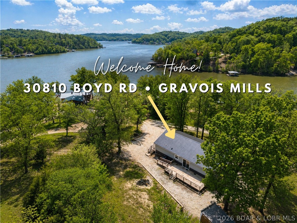 Looking for an affordable Lake of the Ozarks getaway or a full-time lake home? This move-in ready 2-bedroom, 2-bath home on MM 55offers approximately 1,800 square feet of comfortable living space and a beautiful lake view. Conveniently located near a boat launch and dock rentals, it’s perfect for enjoying everything the lake has to offer. Inside, you’ll find an open-concept layout connecting the kitchen, dining, and living area...ideal for both everyday living and entertaining. The kitchen features a pantry and plenty of workspace. The spacious primary suite includes a large bedroom, private bath, and walk-in closet. The second bedroom also offers a generously sized walk-in closet. Additional highlights include a 4-foot crawl space, newer metal roof and siding, and an approximately 8-year-oldbuild, giving you peace of mind and low maintenance. Don’t miss this opportunity to own a well-kept home in a great lake location!