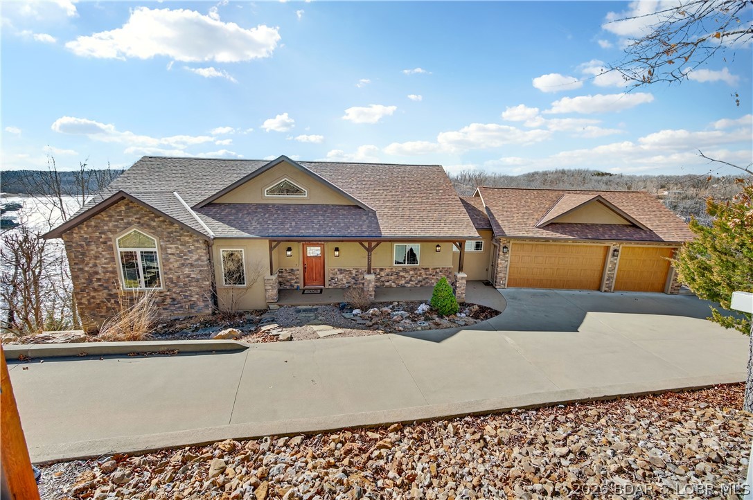 Offered by its original owners, this lovingly maintained 5-bed, 6-bath lakefront home on Linn Creek Cove was built to bring people together. Soaring ceilings, rich wood accents, and open light-filled spaces flow naturally to the outdoors, where deep year-round water and a concrete dock set the stage for memories. Brand new HVAC, 2026 Ruud 14.3 seer 2 stage. The dock features two 12x30 slips, a 12x22 swim platform, and a 4x8 storage locker ,everything needed for a summer of boating, swimming, and lakeside gatherings. A three-car garage handles all the gear, and the large unfinished space below is ready for a guest suite, game room, theater, or fitness space. Cross Creek offers pool and clubhouse access, STR potential, and a 1031 exchange opportunity. Pre-listing inspected with a one-year home warranty included. Built with intention. Ready for your family's next chapter.