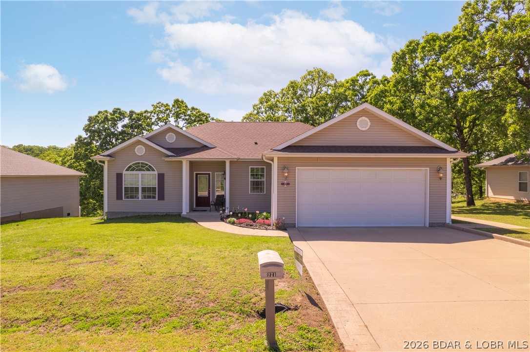 Perfectly positioned in-town, this stylish 3BR/2BA home offers the ideal blend of convenience and comfort—just minutes from Hy-Vee, Target, and the best shopping, dining, and entertainment in Osage Beach. Step inside to soaring 12’ ceilings, vaulted and tray accents, and expansive windows that fill the home with natural light. Tucked in a quiet, well-kept subdivision with charming street lighting and abundant wildlife, the setting is as peaceful as it is inviting. The spacious primary suite features a jetted tub, walk-in shower, and double vanity. Enjoy added privacy and future potential with an additional tract of land included behind the home. A level driveway ensures easy access, while recent updates include a one-year-old roof and brand-new water heater. Seller is offering a $10,000 flooring allowance at closing—an excellent opportunity to make it your own. Don’t miss this move-in ready home in a prime location!