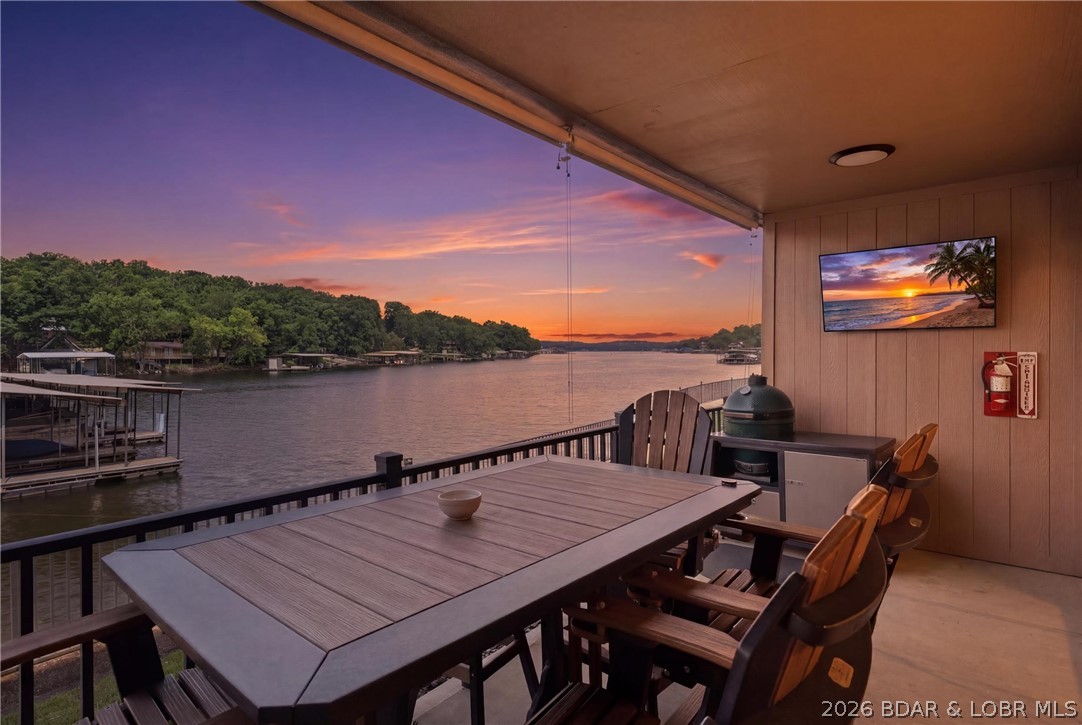 Don’t miss this beautiful 1,800 sq. ft. furnished lakefront walk-out condo, steps from your dock & pool, offering breathtaking views and exceptional amenities. This spacious 2-bedroom, 2-bath unit features a large kitchen with custom cabinetry, tile flooring, tons of storage, custom window treatments, and a full-size laundry room. Enjoy lake living at its finest with a 12’ x 24’ boat slip, located at the 13-mile marker, and take advantage of the community boat ramp. This fully furnished condo is move-in ready, making it perfect as a full-time residence or vacation home. With custom features throughout and spectacular waterfront views, this is a rare opportunity to own a premier lakefront property.