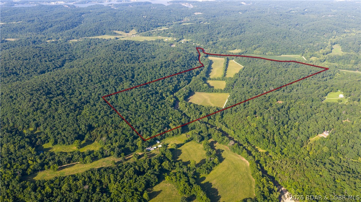 185 acres of prime Missouri ground just minutes from Lake of the Ozarks! This rare property offers huge bottom fields, beautiful creek frontage along the property line, and a great mix of timber for wildlife habitat, making this a true hunter's paradise. Whether you're looking for a productive farm, recreational retreat, hunting property, or future homesite, this farm offers endless possibilities. Large tracts of land in this location rarely hit the market. Don't miss your chance to own a once-in-a-lifetime property near Lake of the Ozarks!