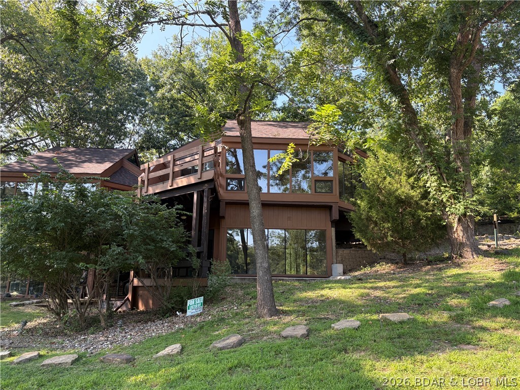 Experience resort-style living in this stunning condo perfectly situated on a beautifully maintained, world class golf course in the heart of Lake of the Ozarks. Wake up to breath taking views and enjoy peaceful mornings on your private balcony overlooking lush greens.  this spacious and well appointed unit offers an open concept layout, abundant natural light and wonderful finishes. Not only is this unit located at a prime location, you have access to the abundance of Four Season amenities!! Whether you want to make this your full time residence, weekend getaway or investment property - this is the one for you! Seller is motivated!! Welcoming offers!!