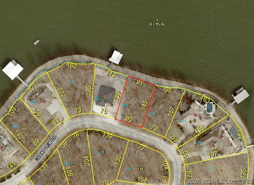 VIEW, VIEW, VIEW........ DEEP WATER……MODERATE TOPOGRAPHY…..WONDERFUL NEIGHBORHOOD/COMMUNITY...GREAT BUILDING SITE…...LOCATED ON GRANDVIEW DRIVE. With easy off-road approach, natural shelf rock seawall (91’ L.F. x139’x90’x145’ lot dimensions. COMMUNITY WATER & SEWER available. Premier location in Porto Cima where the Jack Nicklaus designed Golf Course, The Porto Cima Yacht Club & The Club at Porto Cima are right around the corner with a variety of memberships available. Includes use of all Four Season's amenities including; Hiking & Biking Trails, RV Park and Camping, 3 Private Fishing Lakes, Multiple Pools, Tennis Court, Kay's Point Pavilion and Playground, Kay's Point Dock & Boat Launch, Skate Park & Basketball Courts.