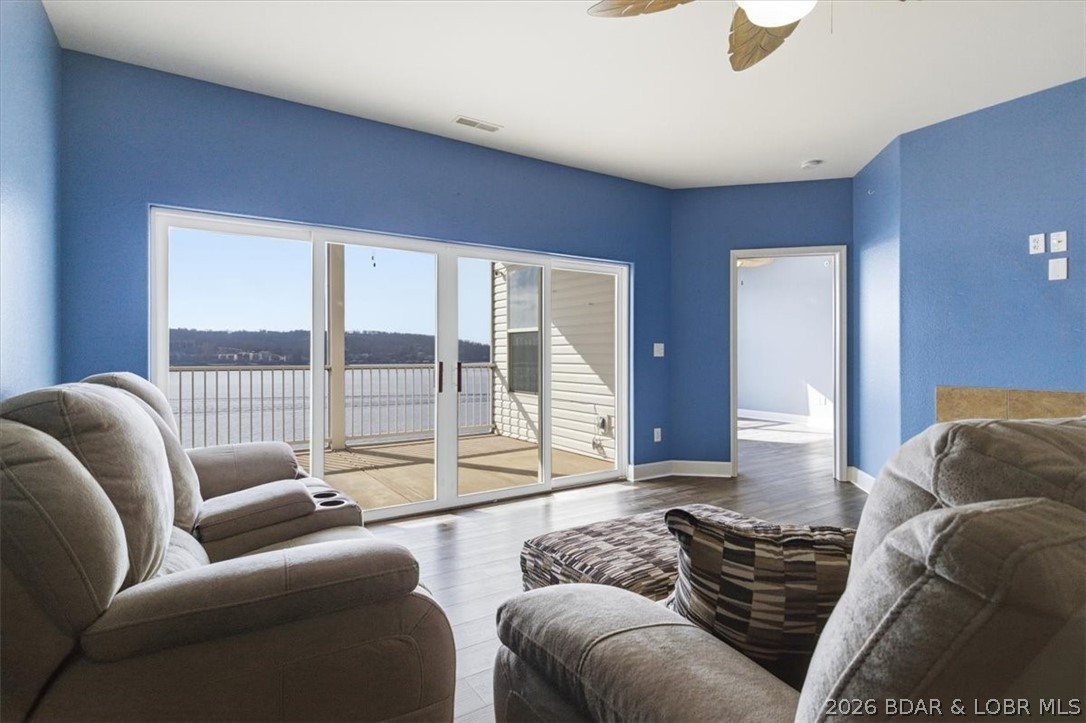 Experience lakefront living at its finest with this rare opportunity to own a 3-Bedroom, 2-Bath condo offering over 1,300 sq ft and TWO 12x32 Boat Slips- a true standout at the lake! Perfectly positioned on the 4 mile-marker of the main channel, this property boasts breathtaking 180-degree panoramic views and unforgettable sunsets from the screened-in deck. Located within a gated, private island community, this condo combines exclusivity with convenience. The complex features elevator access for easy entry to the unit, pool, and docks- making lake life effortless for owners and guests alike. Inside, you'll find a spacious layout with a huge primary suite with a walk-in closet, dual vanities, and a walk-in shower, all centered around those incredible lakeviews! Short-term rentals are allowed, making this not only a dream getaway but also a strong investment opportunity. A short car ride to Bagnell Dam Strip and minutes by boat to several of the lakes hottest destinations, you'll have the best of the lake right at your fingertips. Whether you're looking for a personal retreat, income-producing property, or both - this one checks all the boxes.