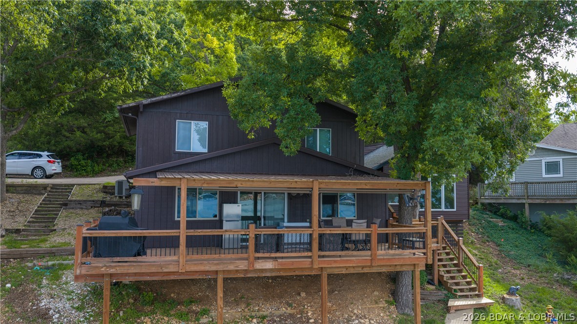 Located at the 43 MM, this lakefront property offers 75’ of shoreline, beautiful wide water views, and a covered deck perfect for relaxing and taking in the scenery. The home features 3 bedrooms and 2 baths with a 2 well dock for all your lake toys and boating adventures.  The home has had some updating over the years but still offers the opportunity for a buyer to bring their own vision and personal touches. The unique detached addition provides extra flexible space and includes a 1/2 bath, making it ideal for guest overflow, a bunk room, entertainment space, or private retreat area.  Whether you’re looking for an affordable lakefront getaway, investment opportunity, or a property to update into your dream lake home, this one has the location, views, and waterfront features you don't want to miss!