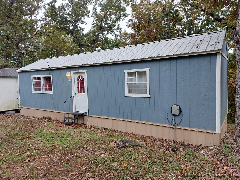 Move in ready! Well maintained 1 bedroom, 1 full bath Tiny Home waiting for you! New ductless MiniSplit installed in 2025 for economical heating and cooling! All appliances included-range, refrigerator, dishwasher, washer, dryer, small freezer. Furniture- table and chairs, two living room chairs, small TV with antenna, small desk and queen size bed. High speed fiber optic internet ready to be connected. What you see is what you get! Store your excess items in the small storage shed that is included. Community water is paid up through September, 2026 so no water fees until then! Private permitted septic installed in 2021. Property was surveyed in 2021 and copies are available. Not often do you find a Tiny Home with a dedicated bedroom and dedicated full bathroom with tub and shower! Make this your home or investment property with no rental restrictions!