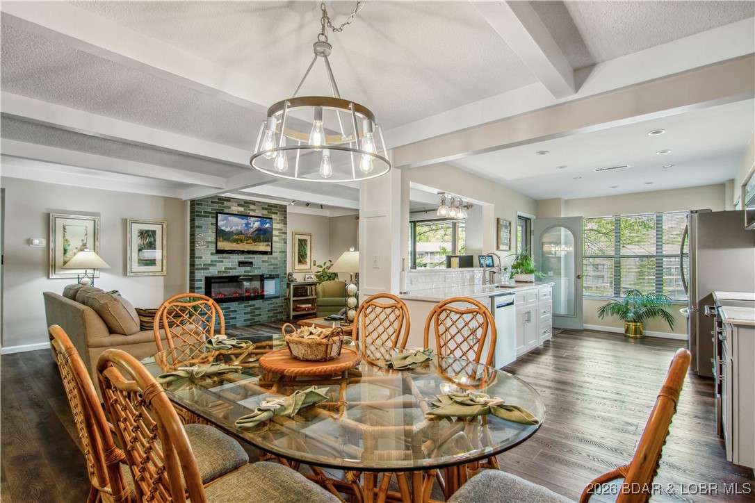 The location at Water's Edge everyone wants. A walk in unit with no steps from parking to the front door, plenty of parking even on the busiest of weekends. If you know Waters Edge you know this is a golf cart friendly community. With this unit you walk out of your condo to the golf cart parking, no long walks up or down hills! Great complex with beautiful grounds, community pool, clubhouse, playground, tennis courts, exercise area, boat ramp, walking trails & even security. The decision of the day will be, do I walk to the enlarged deck and watch the boats dance across the water or wander out the front to the beautiful golf course to watch someone putting and enjoying a round of golf? The fire pit is strategically located across from the golf course green and is a gathering spot (watering hole)! This 3 bed/3 bath unit is 1750 sq ft, has been updated & shows wonderfully. Such a beautiful kitchen, with custom cabinets, quality appliances, quartz tops, wonderful fixtures & beautiful flooring. You have to see it, this is a special unit, with 12X32 boat slip, boat hoist, cover, & comes furnished. This isn't for everyone its for THE ONE that can appreciate how hard this is to duplicate!