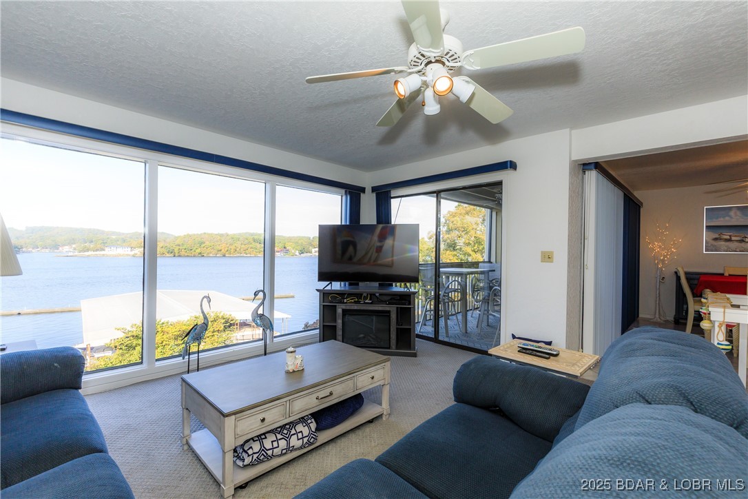 Happiness. Tranquility. Relaxation. Exhilaration. Revitalization.
Welcome to your lakeside retreat — where life slows down and every moment feels special. This charming two-level condo offers 3 bedrooms and 3 full bathrooms, perfectly designed for comfort and connection. Sip your morning coffee or unwind with evening cocktails on one of two inviting decks, surrounded by panoramic lake views and unforgettable sunsets. Whether you’re seeking quiet reflection or joyful gatherings with family and friends, this is where memories are made and spirits are renewed.
Complex amenities: 2 pools, Fitness Room, Clubhouse, Kids Play Area, Dog Park, Firepit Area, Boat Docks, Boat Trailer Parking.
**Offered for additional purchase is another 10x24 boat slip w/ lift, remote and dock locker (Dock 2, Slip 2L). Inquire for pricing.