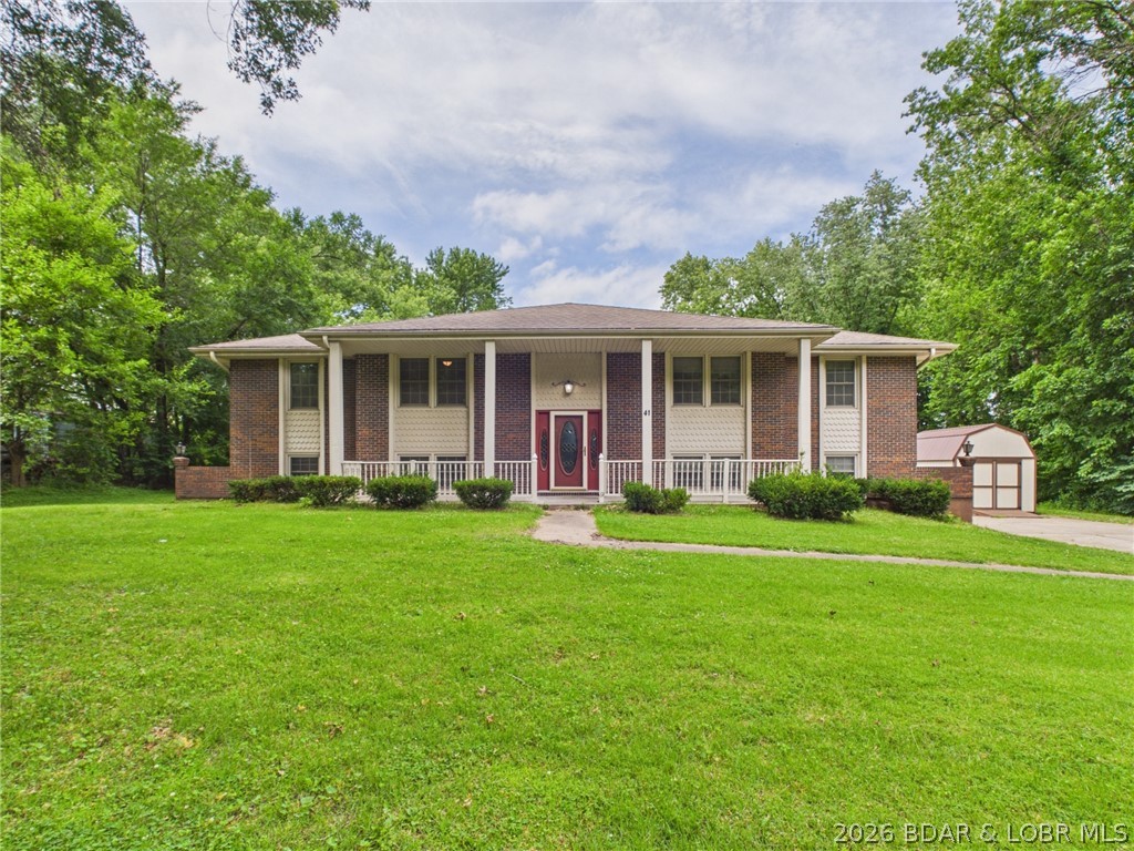 Located In Warrensburg, Mo. 4-bed, 3 ba  Sitting on LG treed lot, this property offers a convenient location near the bypass to WAFB, Hwy 50 & I-70. Seller has enhanced the property with an additional 50-foot driveway extension, creating the perfect space for camper or recreational vehicle parking. The main level offers exceptional living space with 2 LG living rms, eat-in kitchen nook & a versatile flex rm that can serve as an office, playroom or formal dining area. The primary suite is generously sized & features 2 walk-in closets. Primary en-suite ba is complete with walk-in shower & LG vanity. Two additional main-level bedrooms are significantly oversized and provide ample closet space and storage. Step outside from one of the living rooms onto the expansive double-tier deck overlooking the large backyard. The 2nd deck provides access to the above-ground swimming pool, creating an ideal setting for outdoor entertaining & summer fun. The finished basement includes a spacious 4th bed with walk-in closet, a full ba with a tiled walk-in shower & charming built-in storage cubbies, an additional family room, and a custom bar area featuring a kegerator, shelving, and accent lighting.