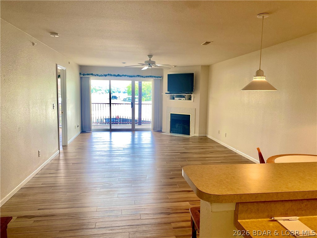 ***Garage Available*** Start your lake adventures in this 2-bedroom, 2-bath waterfront condo that offers lake views & the perfect blend of comfort, convenience, and lake lifestyle living. Featuring an open-concept floor plan, this inviting condo is ideal for relaxing weekends, full-time living, or a vacation retreat or nightly rentals. 

MORE PHOTOS TO COME - For video and more photos of complex, go to: Clearwater Condominiums at Lake of the Ozarks _ COA in Camdenton, MO  or  https://www.youtube.com/watch?v=ARrOifkM4T0&t=99s
The master bedroom offers lake views, access to the deck, ample closet space, and a private bath with dual sinks, while the second bedroom and full guest bath provide plenty of room for guests. Included with the property is a boat slip so you can spend your days enjoying everything lake life has to offer.

Located in a desirable waterfront community, this condo is truly move-in ready and designed for effortless lake living for a weekend retreat, investment opportunity, or your own slice of paradise on the water, and checks a lot boxes.