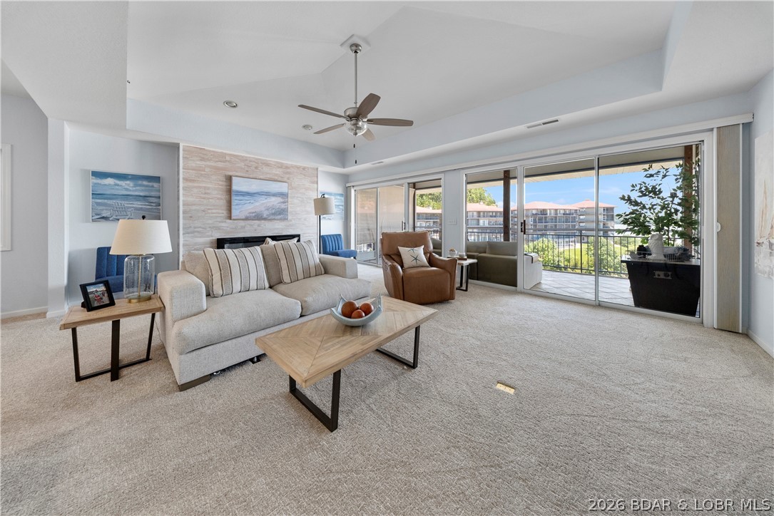 Experience the best of Lake of the Ozarks living in this stunning Palisades condominium at the highly sought-after 14 MM. Beautifully maintained and offered turnkey, this move-in ready retreat combines upscale comfort with breathtaking lake views. The spacious open-concept design creates an inviting atmosphere for entertaining and everyday living, while large windows fill the home with natural light and showcase the beauty of the lake.

The primary suite is a private sanctuary featuring a walk-in closet, oversized soaking tub, and walk-in shower. Step onto the expansive covered deck and unwind as you take in panoramic water views, peaceful surroundings, and unforgettable sunsets.

A 12x32 boat slip is included, providing effortless access to days spent cruising, boating, and enjoying the water. Residents enjoy exceptional resort-style amenities, including a gorgeous lakeside pool and beautifully maintained grounds. Conveniently located in Lake Ozark, just minutes from the Bagnell Dam Strip, waterfront dining, shopping, entertainment, golf, and the area's most popular attractions. No matter what you are looking for, this condo is sure to deliver!