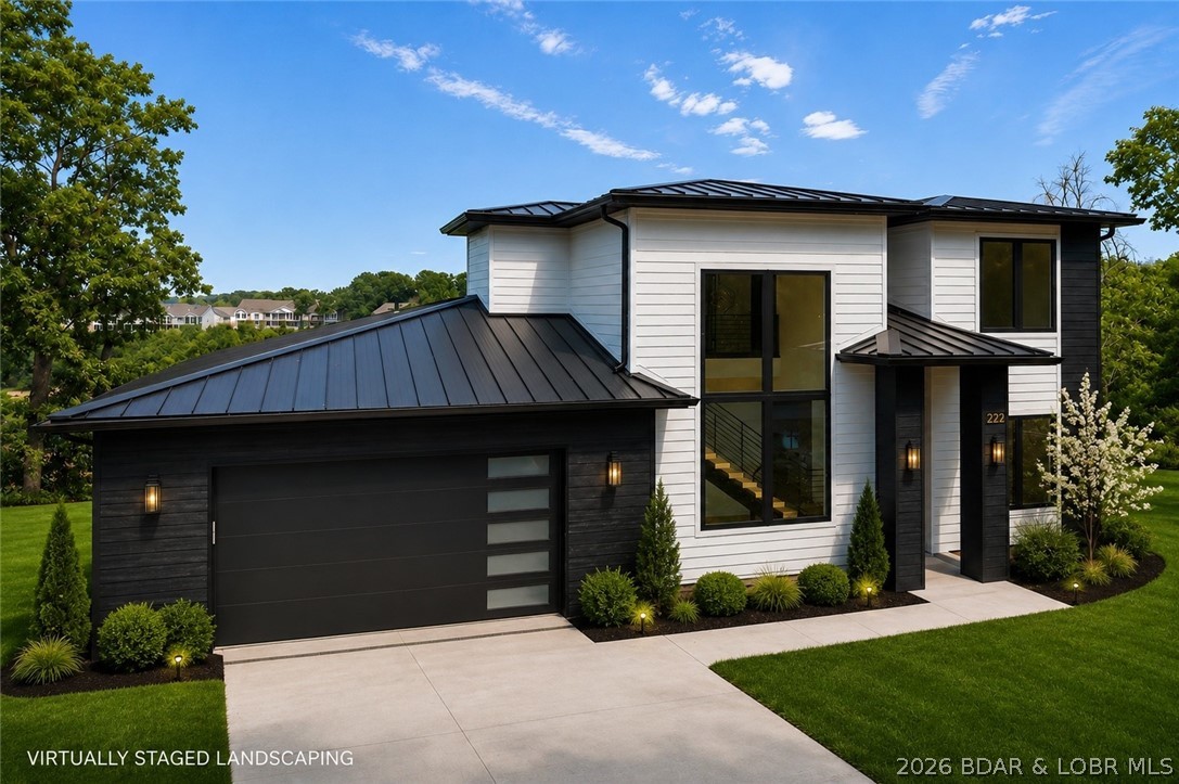 Introducing an exceptional new construction residence in the prestigious Waters Subdivision at the 3 MM, where sophisticated design meets effortless lake living. Spanning approximately 3,000 square feet, every space has been thoughtfully curated with impeccable craftsmanship and designer finishes. A dramatic floating staircase framed by soaring floor-to-ceiling windows creates a breathtaking focal point, while the gourmet kitchen features an expansive quartz island, custom cabinetry, walk-in pantry, coffee bar, and premium finishes throughout. The open-concept living area is anchored by a stunning fireplace, creating an elegant setting for entertaining. The main-level primary suite offers a spa-inspired retreat with a freestanding soaking tub, oversized walk-in shower, heated floors, and a spacious walk-in closet. With gorgeous lake views, an included future pool and landscaping currently underway, plus available boat slips, this home offers everything you could dream of. Just minutes from the Bagnell Dam Strip, waterfront dining, shopping, and entertainment, this home delivers refined luxury and the ultimate Lake of the Ozarks lifestyle.