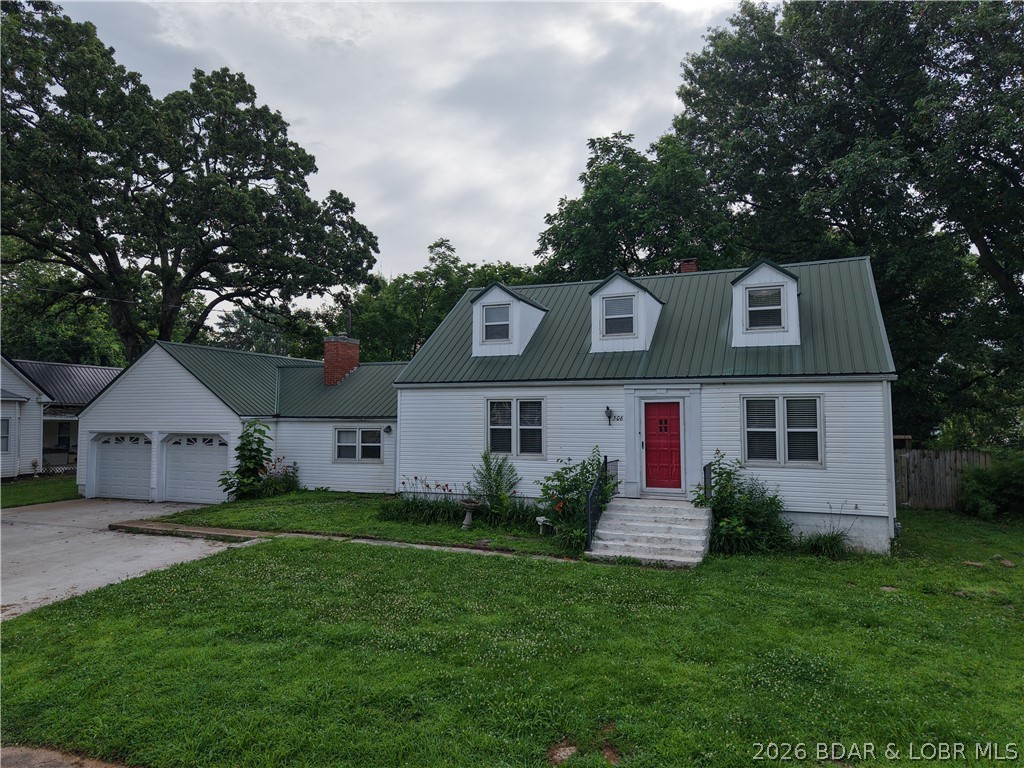 This charming 5-bedroom, 2.5-bath home is full of timeless details you just don't find anymore. From the original hardwood floors to the quirky built-ins throughout the home, every room has its own personality.
Step through the front door into a welcoming living room that sets the tone for the rest of the home. Just off the living room, you'll find two main-level bedrooms and a full bathroom. The beautifully remodeled kitchen blends modern updates with classic charm and serves as the heart of the home. Beyond the kitchen is a second living space featuring a cozy wood-burning stove. Whether you need a family room, formal dining room, playroom, or entertaining space, this room gives you plenty of options. Just off the second living area, the sunroom is the perfect place to enjoy your morning coffee, unwind after a long day, or soak in the natural light year-round. The main-level laundry room adds even more convenience. Upstairs, you'll find three additional bedrooms and another full bathroom.Outside, you'll love the privacy-fenced backyard— and the attached 2-car garage provides plenty of room for parking.