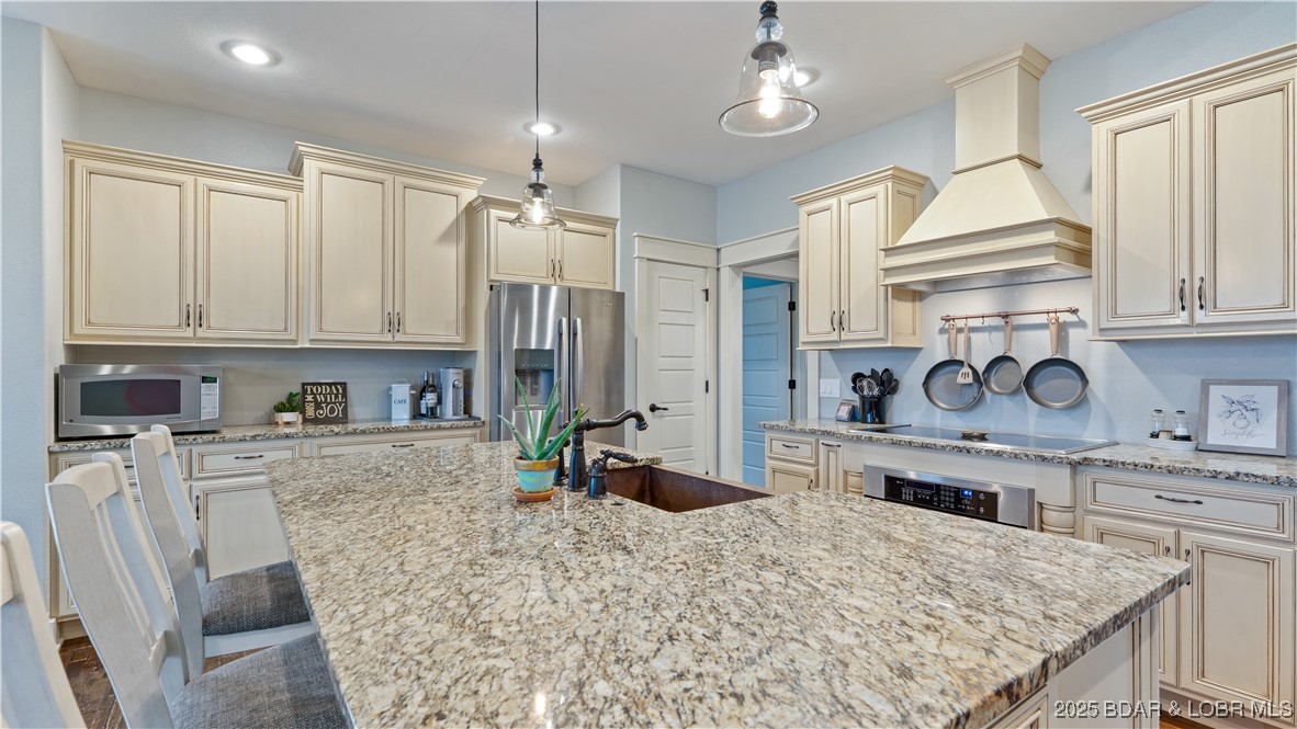 WOW! This lake access home delivers incredible value. Brand new roof installed May 2026 & a new price that is hard to beat!  This custom Craftsman home is priced at $157/sq ft - well below todays replacement cost. Enjoy peace of mind knowing this big-ticket update has been completed. This stunning, home offers nearly 4400 sq ft of luxurious living space, featuring 6 generously sized bedrooms, an open & alluring floor plan, & exceptional storage throughout. From the inviting screened-in-deck to the cozy two-way fireplace this home welcomes you w/ well-designed, intentional details. Hardwood floors add timeless character & warmth to the main living areas.  A 3rd lower-level garage has many possibilities like storage, workshop, fitness or hobbies. A rare luxury is the FLAT yard & driveway w/ ample parking. Even better this property includes a 12x32 BOAT SLIP, giving you instant access to lake living. The finished 6th bedroom above the garage has its own 1/2 bath and is ideal for working from home office space.   The Estates community has a private pool to soak up the sun & socialize w/ your neighbors. Value. Quality. Equity. 135 Windjammer has it all. Now is the time to make it yours!