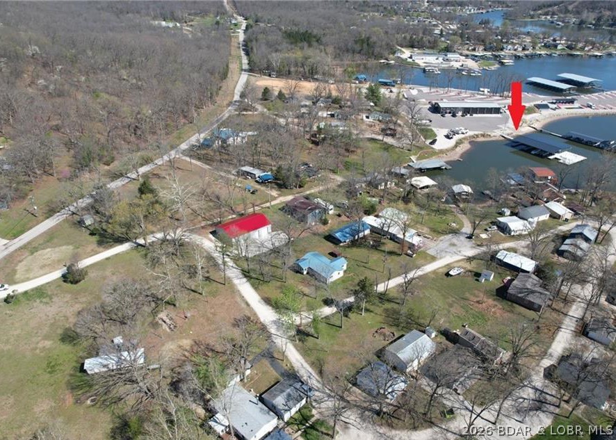 Dreams DO come true! Build your own lake house on this 0.79 acre lot at the 38 MM!! Improvements include electrical hook up for an RV, and a Well. If you are deciding between building and buying an existing home, this lot is THE one for you. NO gravel roads, beautiful views and close to Premier Advantage Marine. Location, location, location and views! Come check it out!