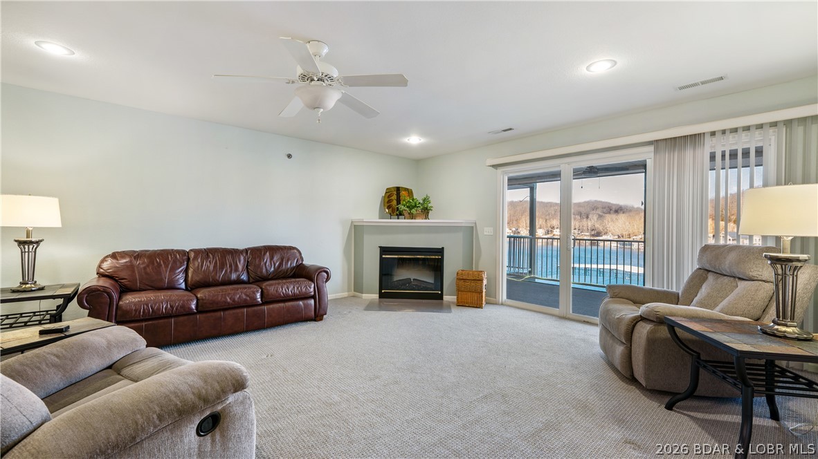 Walk in with no steps and start enjoying the ease of lakefront living. This furnished 2-bedroom, 2 bath condo includes a 12x30 boat slip with 8,000# lift, making it easy to spend your days on the water. The open floor plan offers a comfortable space for gathering with family and friends, while the screened deck overlooks a peaceful deep-water cove; perfect for morning coffee or relaxing evenings.  Conveniently located near popular lakefront and land-based restaurants, you’ll enjoy easy access to the best the lake has to offer. Nestled within a well-maintained complex where rentals are not allowed, this condo is ideal for full-time living or a private weekend getaway.
