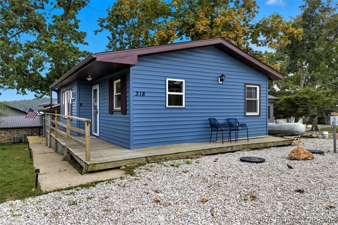 Lake living without the waterfront price! Welcome to this updated 2 bed, 1 bath home in the desirable Long Acre Subdivision at the 38 MM of the Osage Arm. This approximately 1,200 sq. ft. second-tier home offers seasonal lake views and is just steps from a water easement for swimming, with a marina only about a mile away. Recent updates include new exterior paint, numerous new windows, newer roof (approx. 4 years), new septic system, new living room carpet, new LVP flooring in the kitchen, new range, and updated lighting and ceiling fans throughout. Currently operating as a successful Airbnb and VRBO while still enjoyed by the owner, this property is ideal as a full-time residence, vacation home, or investment. Conveniently located near Bear Bottom Resort, Frankie & Louie’s, Tap & Grill, Coconuts, The Cave, and many other popular Lake of the Ozarks restaurants and attractions. Owner/Agent.