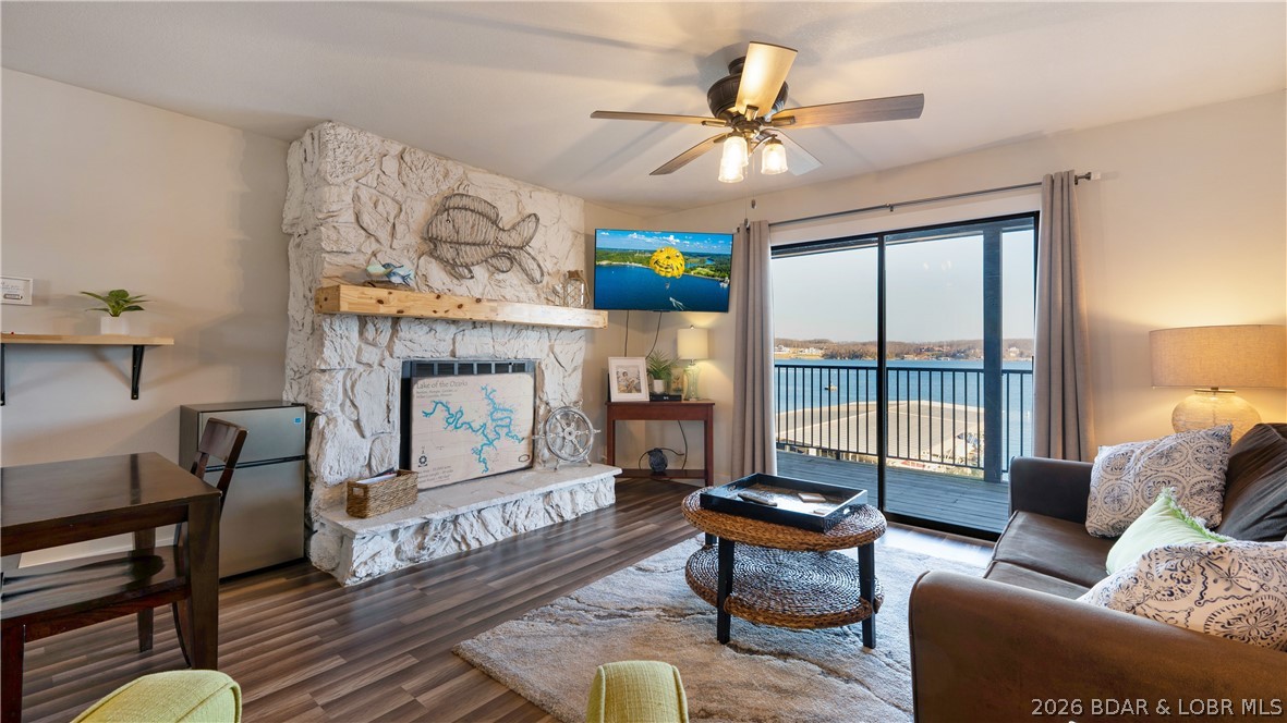 Discover the perfect Lake of the Ozarks getaway with this beautifully updated, turnkey condo in the heart of Osage Beach. Nestled in a protected cove while capturing sweeping main channel views, this inviting unit offers the best of both worlds. The completely remodeled kitchen features new cabinetry, butcher block countertops, tile backsplash, updated appliances, sink, fixtures, and an open layout that showcases the lake from the kitchen, dining area, living room, and primary bedroom. Fresh paint, new trim, doors, and luxury vinyl plank flooring create a bright, modern feel throughout. The renovated bathroom includes a new vanity, fixtures, tile flooring, and a tiled tub surround. Relax on the expansive lakeside deck or enjoy the lakeside pool and clubhouse overlooking the water. Located next to Shorty Pants, you can walk to dining and entertainment, with shopping, golf, attractions, and countless waterfront restaurants just minutes away by land or water. Whether you're looking for a personal lake retreat or a rental investment, this move-in-ready condo checks every box.