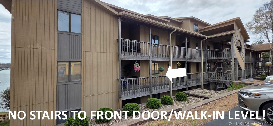 Reduced! SELLER WILL PAY $12,144 for 1st year's HOA! Boating Season is here! Deals like this don't come along very often... PARKING LOT LEVEL Condo (no stairs to front door) WITH a GARAGE & 40 foot long covered cruiser BOAT SLIP on MILE MARKER 10 with a BEAUTIFUL VIEW OF THE LAKE! It comes TURN-KEY, FURNISHED, MOVE-IN READY! As is. All you need to bring is your tooth brush and swimming suit! Included in sales price: remote controlled boat lift w/ tandem storage for 2 waverunners alongside where you would park your boat. Boat dock is covered, has electricity, and water for cleaning the boat in a cove location with year-round deep water and protected by wavebreaks. Garages are a rare commodity in this complex - this condo comes with one that is insulated, with 220 electric, electric opener, built-in shelves and workbench. Ranch unit with open spacious floorplan! Kitchen has been updated with TWO REFRIGERATORS, deep pantry w/ spin-out storage shelves for easy accessibility, newer granite counters, oversized composite black granite sink, and breakfast bar seating open to the dining room. Both baths have been updated! New jetted tub with new tile surround! Updated flooring!