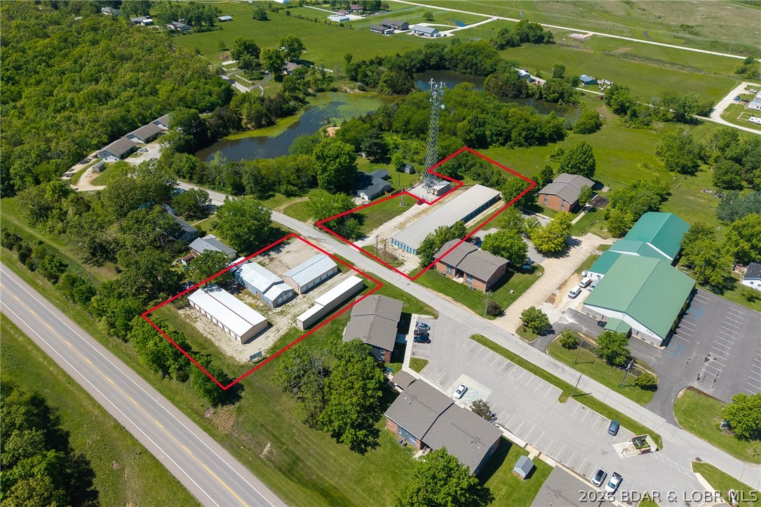 Prime investment opportunity with this 100-unit self-storage complex featuring excellent highway frontage and visibility. The property offers a well-balanced mix of unit sizes to meet strong local demand, including 5x10, 6x10, 7x16, 10x16, and 10x20 units, along with one oversized 36x28 unit ideal for vehicle, RV, or equipment storage and one 10x28 unit for larger storage needs. Recent capital improvements include newly installed security cameras, enhancing tenant safety and asset security. With easy access, strong exposure to passing traffic, and a versatile unit mix appealing to both residential and commercial users, this storage facility is positioned for consistent income and long-term growth.